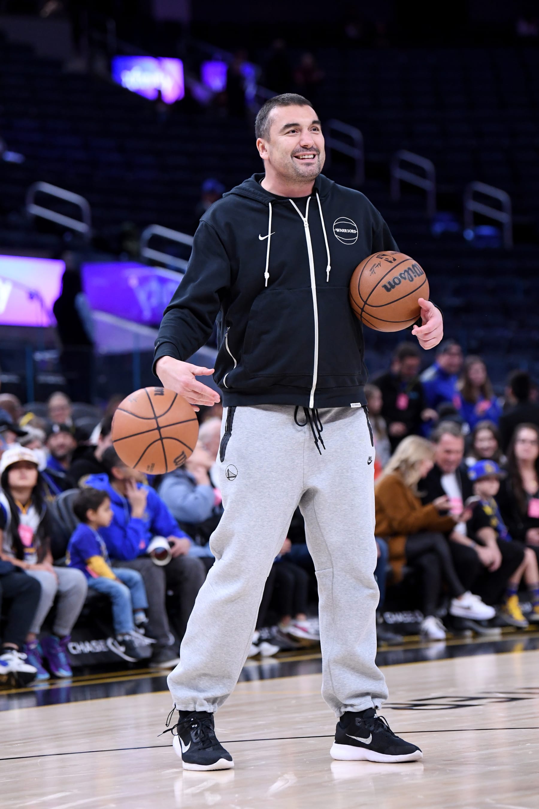 SAN FRANCISCO, CA- JANUARY 7: Assistant Coach Dejan MilojeviÄ of the Golden State Warriors does some pregame work prior to the game against the Toronto Raptors on January 7, 2024 at Chase Center in San Francisco, California. NOTE TO USER: User expressly acknowledges and agrees that, by downloading and or using this photograph, User is consenting to the terms and conditions of the Getty Images License Agreement. Mandatory Copyright Notice: Copyright 2024 NBAE  (Photo by Noah Graham/NBAE via Getty Images)