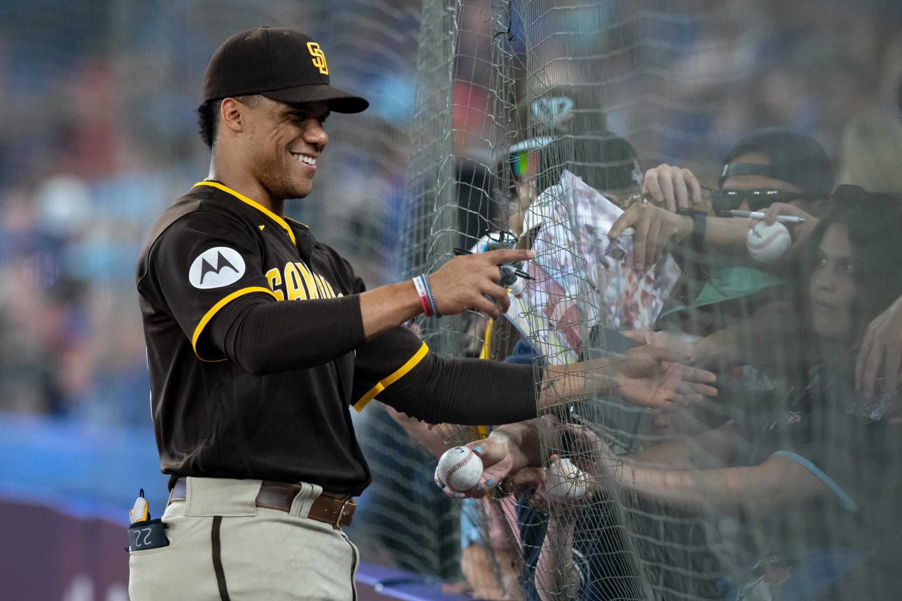TORONTO, ON - JULY 19: San Diego Padres Outfield Juan Soto (22) signs autographs before the MLB baseball regular season game between the San Diego Padres  and the Toronto Blue Jays on July 19, 2023, at Rogers Centre in Toronto, ON, Canada. (Photo by Julian Avram/Icon Sportswire via Getty Images)