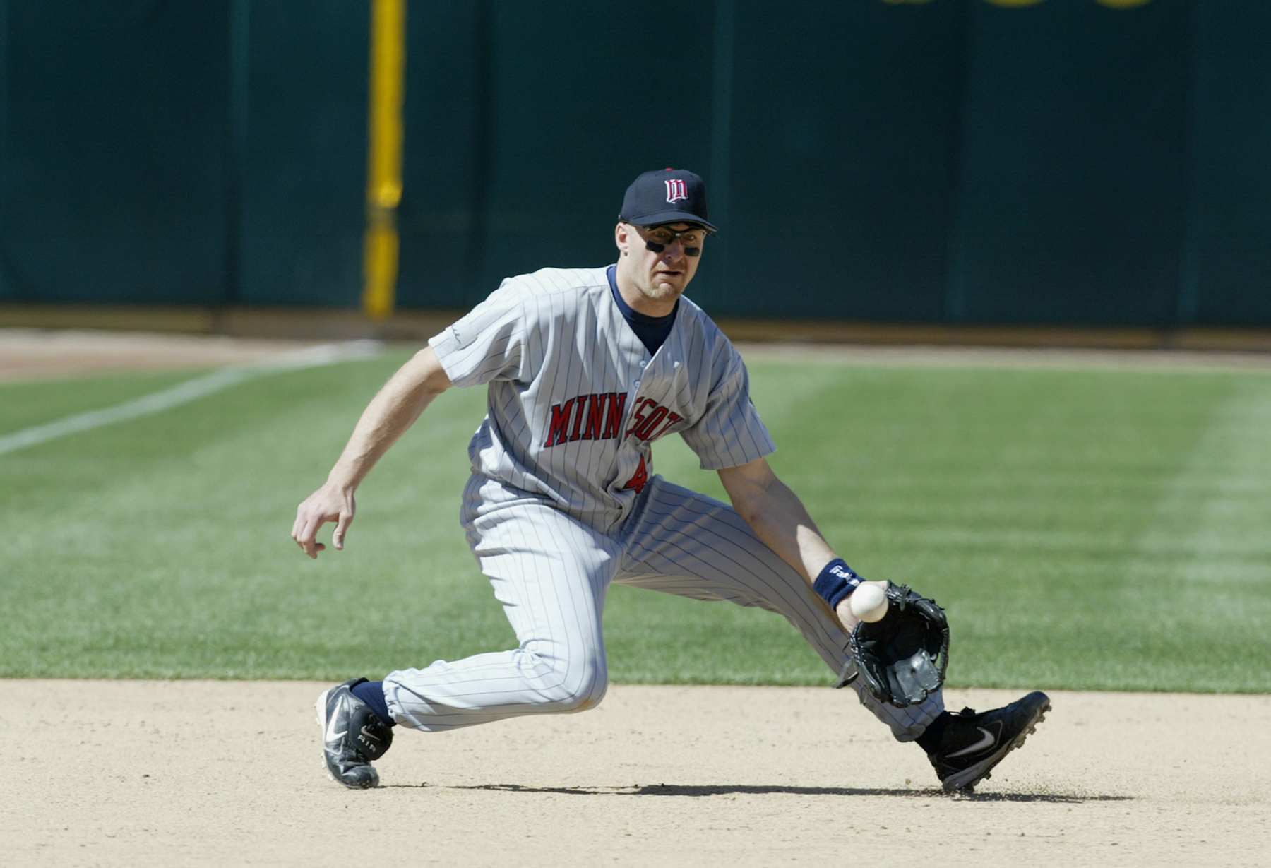 OAKLAND, CA - MAY 8:  Corey Koskie#47 of the Minnesota Twins fields a ground ball during the game against the Oakland Athletics at the Network Associates Coliseum on May 8, 2004.  The Twins defeated the A's 3-2.  (Photo by Don Smith/MLB Photos via Getty Images)