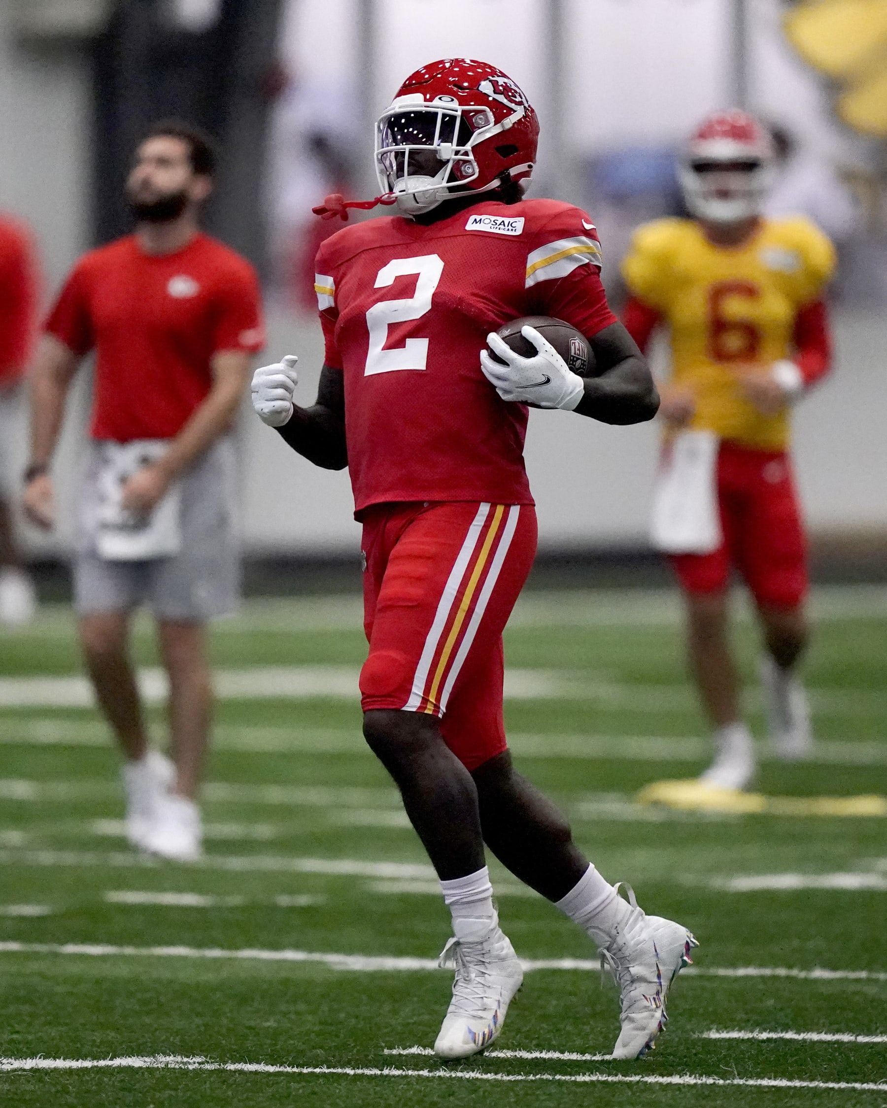Kansas City Chiefs running back Ronald Jones runs the ball at NFL football training camp Wednesday, Aug. 3, 2022, in St. Joseph, Mo. (AP Photo/Charlie Riedel)
