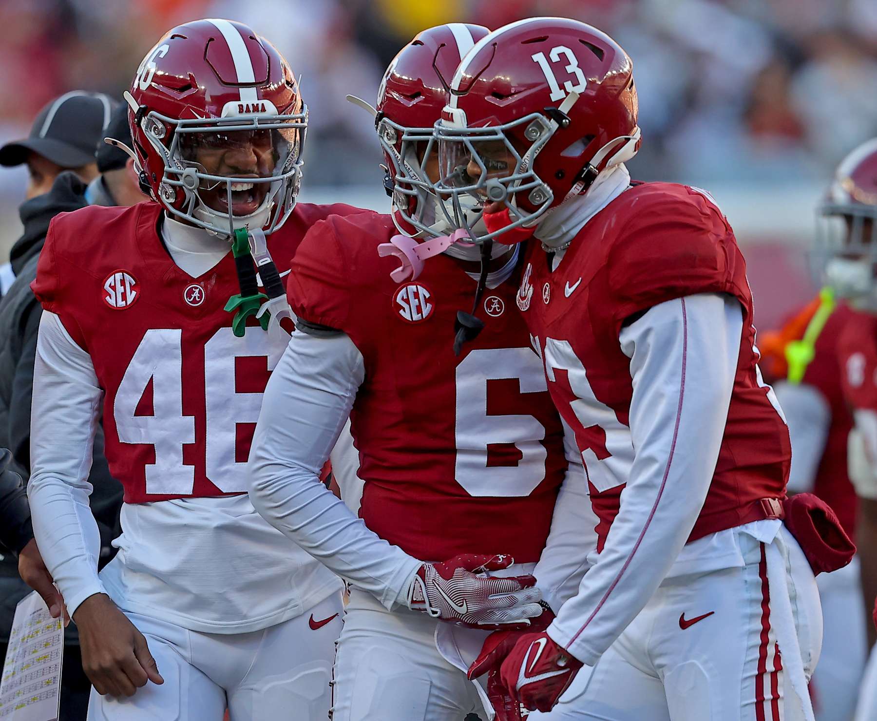 TUSCALOOSA, ALABAMA - NOVEMBER 30: Malachi Moore #13 of the Alabama Crimson Tide celebrates with teammates Chase Davis #46 and Kameron Howard #6 during the first half at Bryant-Denny Stadium on November 30, 2024 in Tuscaloosa, Alabama. (Photo by Jason Clark/Getty Images)