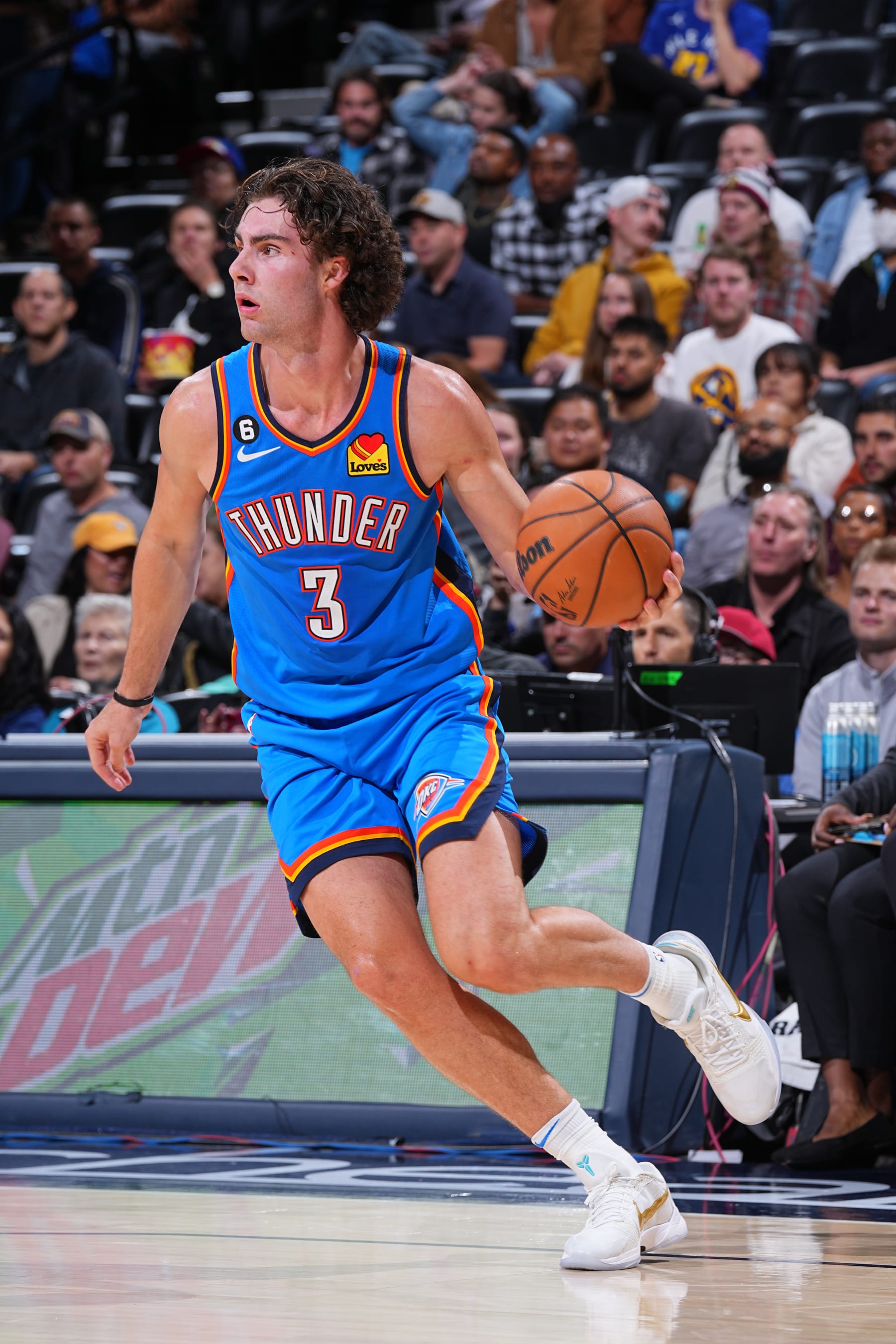 DENVER, CO - OCTOBER 3: Josh Giddey #3 of the Oklahoma City Thunder drives to the basket during the game against the Denver Nuggets on October 3, 2022 at the Ball Arena in Denver, Colorado. NOTE TO USER: User expressly acknowledges and agrees that, by downloading and/or using this Photograph, user is consenting to the terms and conditions of the Getty Images License Agreement. Mandatory Copyright Notice: Copyright 2022 NBAE (Photo by Bart Young/NBAE via Getty Images)