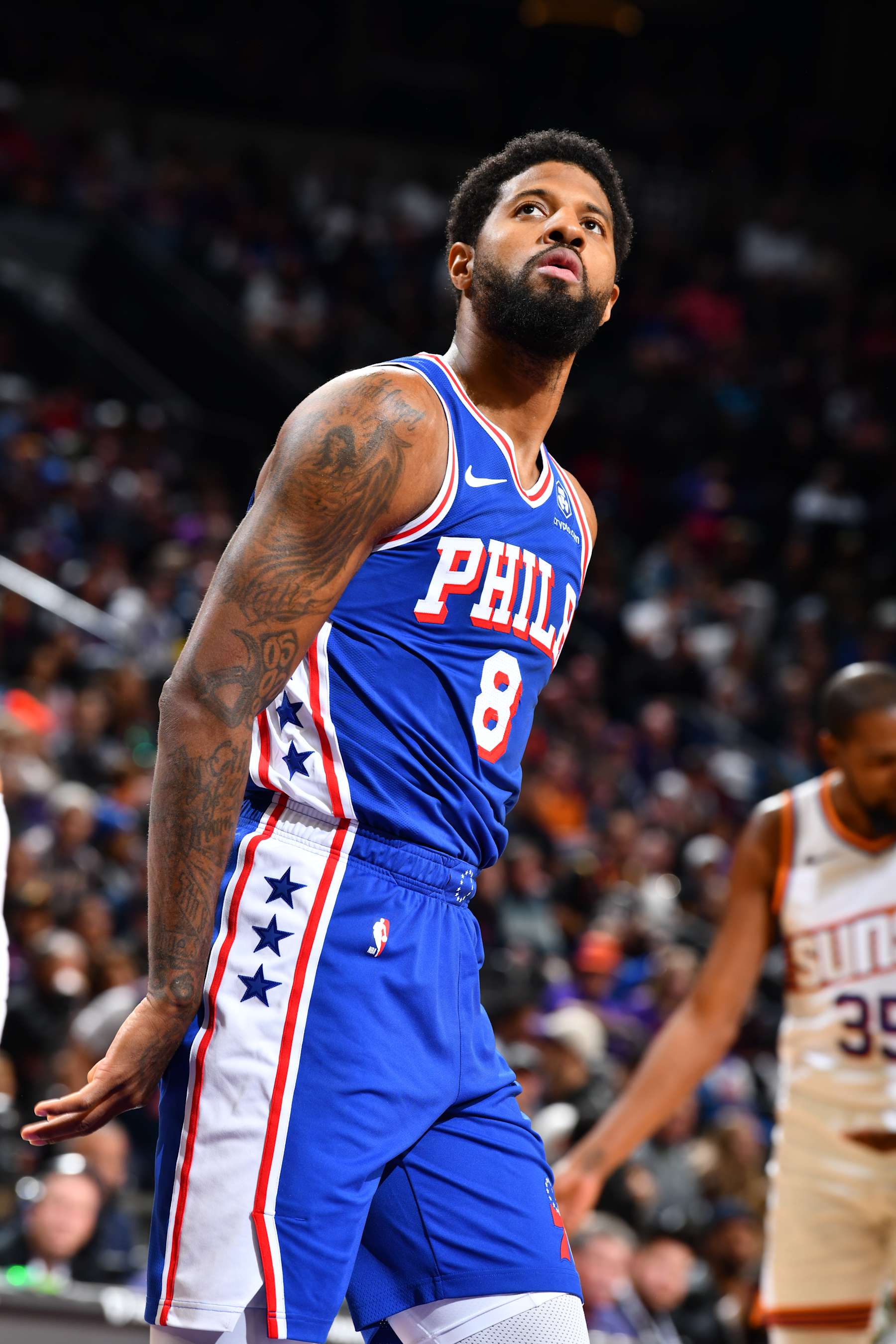 PHOENIX, AZ - NOVEMBER 4: Paul George #8 of the Philadelphia 76ers looks on during the game against the Phoenix Suns on November 4, 2024 at Footprint Center in Phoenix, Arizona. NOTE TO USER: User expressly acknowledges and agrees that, by downloading and or using this photograph, user is consenting to the terms and conditions of the Getty Images License Agreement. Mandatory Copyright Notice: Copyright 2024 NBAE (Photo by Barry Gossage/NBAE via Getty Images)