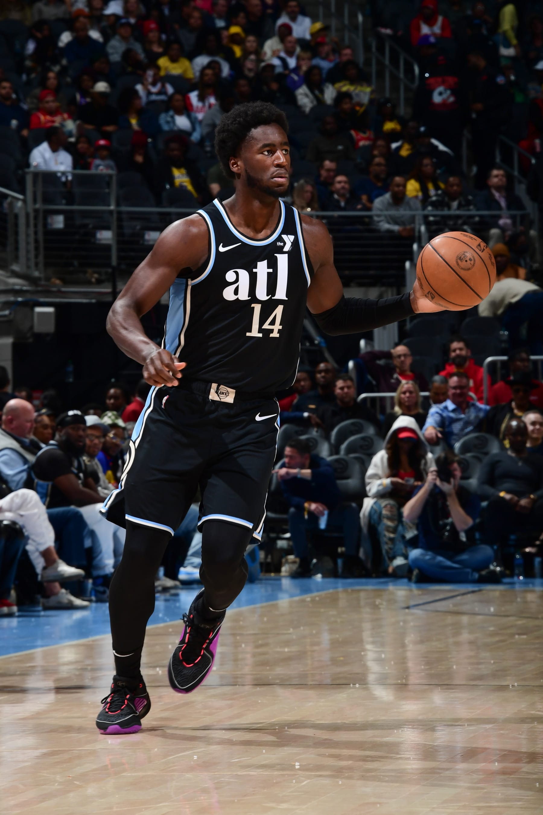 ATLANTA, GA - JANUARY 30: AJ Griffin #14 of the Atlanta Hawks handles the ball during the game on January 30, 2024 at State Farm Arena in Atlanta, Georgia.  NOTE TO USER: User expressly acknowledges and agrees that, by downloading and/or using this Photograph, user is consenting to the terms and conditions of the Getty Images License Agreement. Mandatory Copyright Notice: Copyright 2024 NBAE (Photo by Scott Cunningham/NBAE via Getty Images)