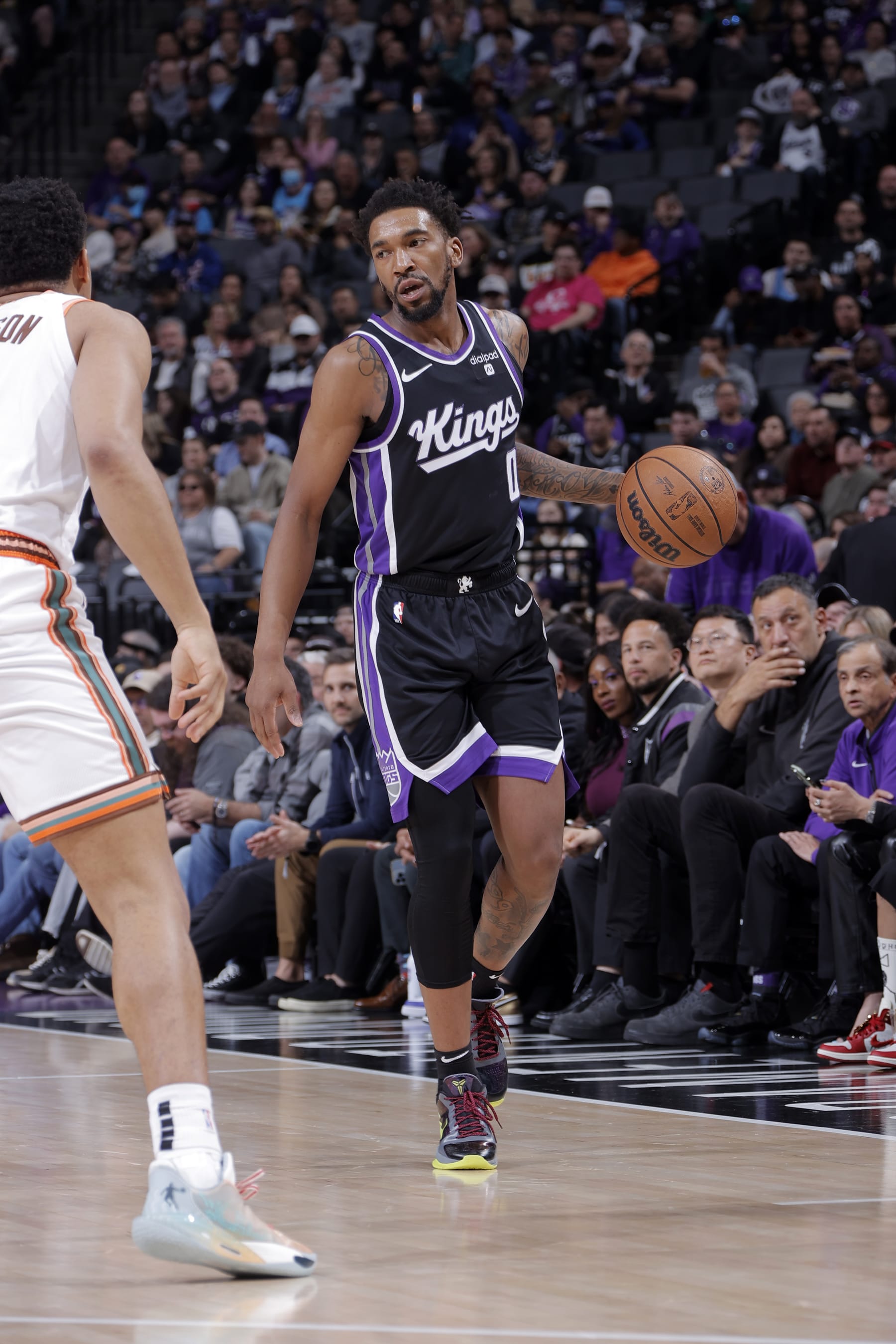 SACRAMENTO, CA - FEBRUARY 22: Malik Monk #0 of the Sacramento Kings dribbles the ball during the game against the San Antonio Spurs on February 22, 2024 at Golden 1 Center in Sacramento, California. NOTE TO USER: User expressly acknowledges and agrees that, by downloading and or using this Photograph, user is consenting to the terms and conditions of the Getty Images License Agreement. Mandatory Copyright Notice: Copyright 2023 NBAE (Photo by Rocky Widner/NBAE via Getty Images)