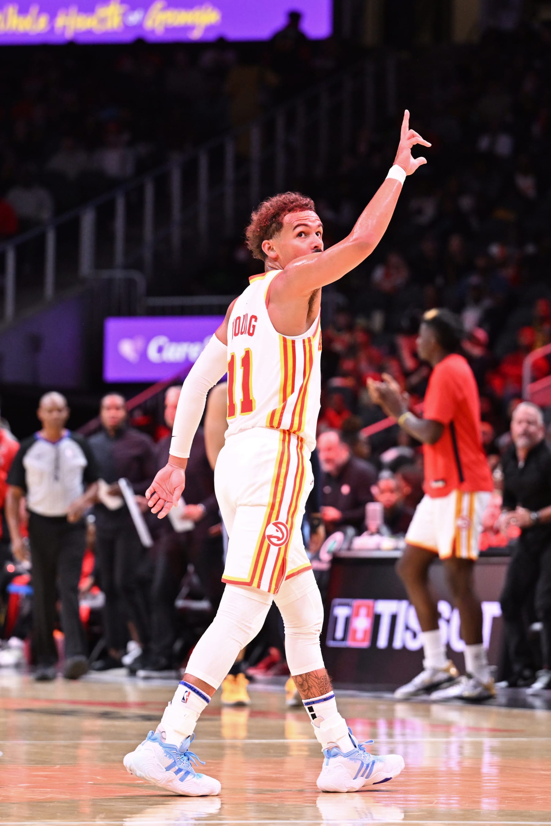 ATLANTA, GA - OCTOBER 12: Trae Young #11 of the Atlanta Hawks looks on during the game against the Memphis Grizzlies on October 12, 2023 at State Farm Arena in Atlanta, Georgia.  NOTE TO USER: User expressly acknowledges and agrees that, by downloading and/or using this Photograph, user is consenting to the terms and conditions of the Getty Images License Agreement. Mandatory Copyright Notice: Copyright 2023 NBAE (Photo by Adam Hagy/NBAE via Getty Images)