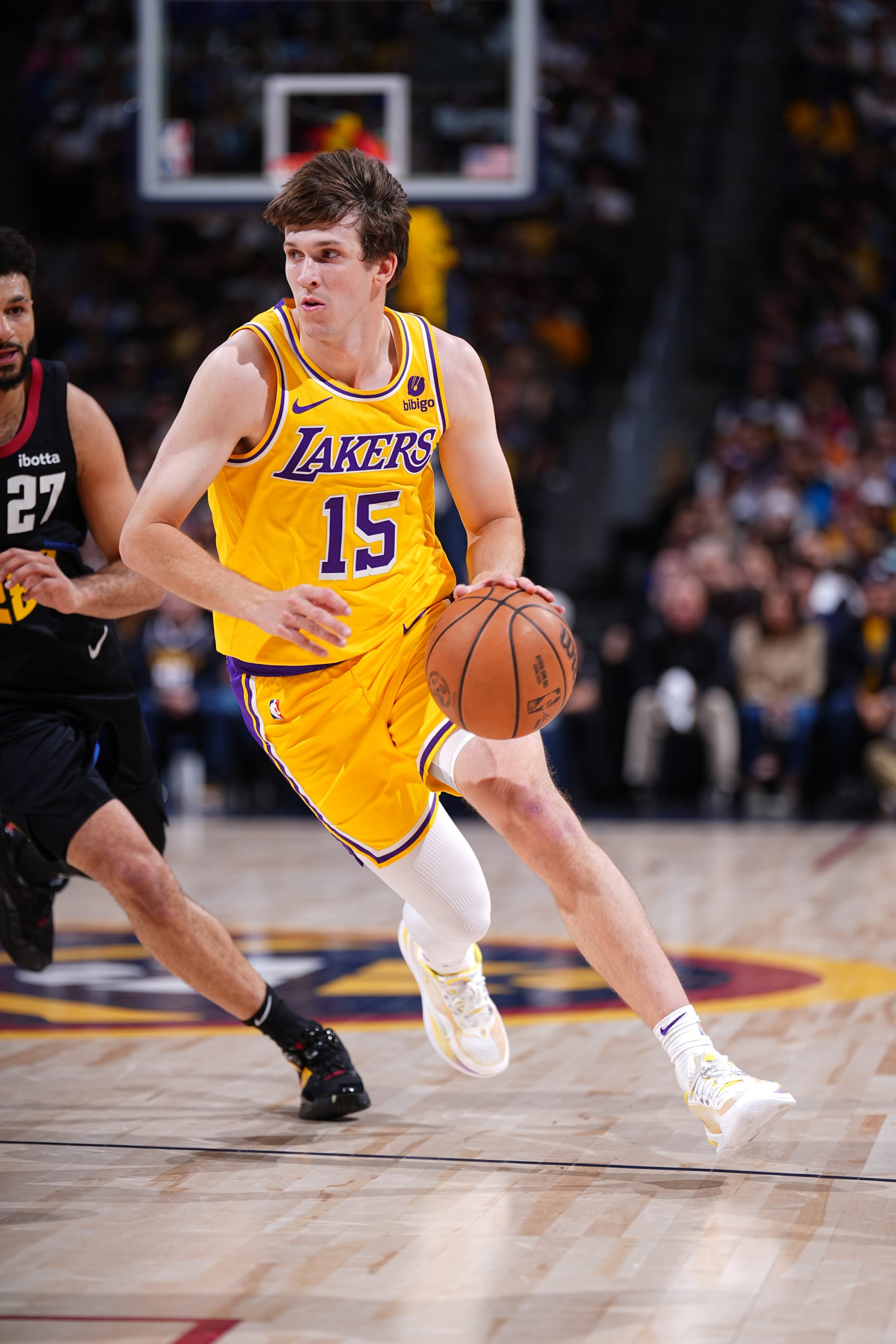 DENVER, CO - APRRIL 22: Austin Reaves #15 of the Los Angeles Lakers drives to the basket during the game against the Denver Nuggets during Round 1 Game 2 of the 2024 NBA Playoffs on April 22, 2024 at the Ball Arena in Denver, Colorado. NOTE TO USER: User expressly acknowledges and agrees that, by downloading and/or using this Photograph, user is consenting to the terms and conditions of the Getty Images License Agreement. Mandatory Copyright Notice: Copyright 2024 NBAE (Photo by Garrett Ellwood/NBAE via Getty Images)