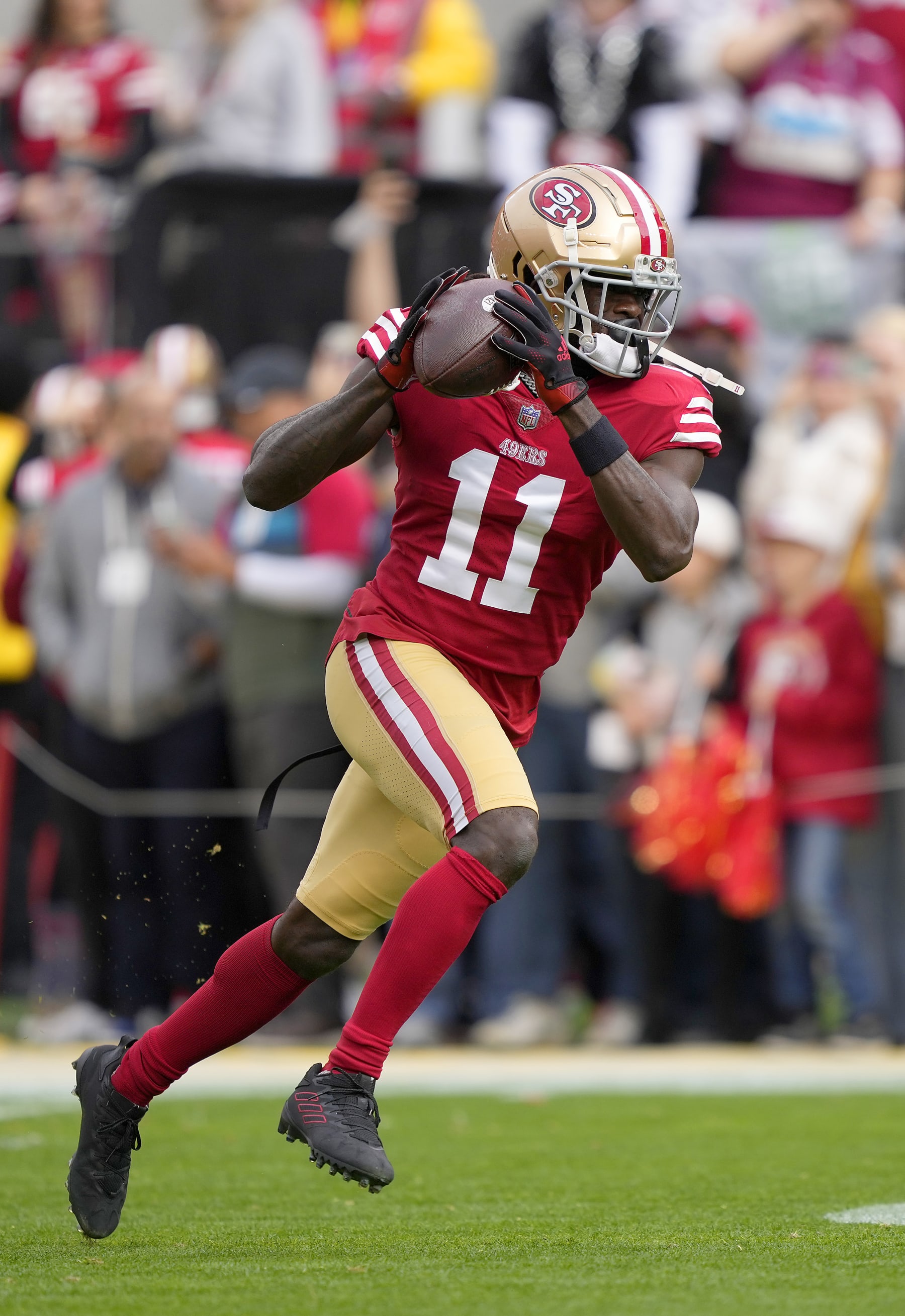SANTA CLARA, CALIFORNIA - JANUARY 08: Brandon Aiyuk #11 of the San Francisco 49ers warms up during pregame warm ups prior to the start of the game against the Arizona Cardinals at Levi's Stadium on January 08, 2023 in Santa Clara, California. (Photo by Thearon W. Henderson/Getty Images)