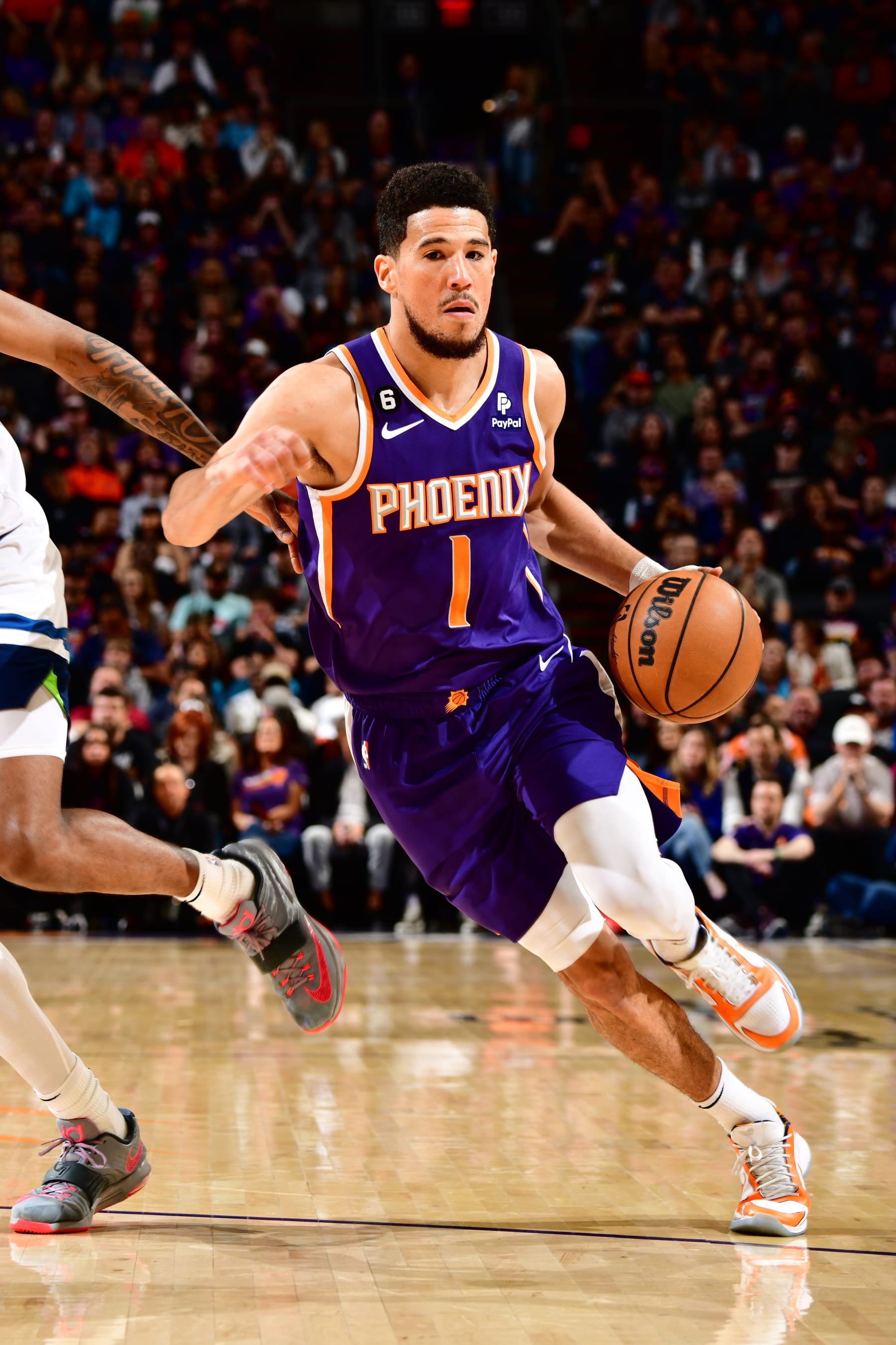 PHOENIX, AZ - MARCH 29: Devin Booker #1 of the Phoenix Suns dribbles the ball during the game against the Minnesota Timberwolves on March 29, 2022 at Footprint Center in Phoenix, Arizona. NOTE TO USER: User expressly acknowledges and agrees that, by downloading and or using this photograph, user is consenting to the terms and conditions of the Getty Images License Agreement. Mandatory Copyright Notice: Copyright 2022 NBAE (Photo by Barry Gossage/NBAE via Getty Images)