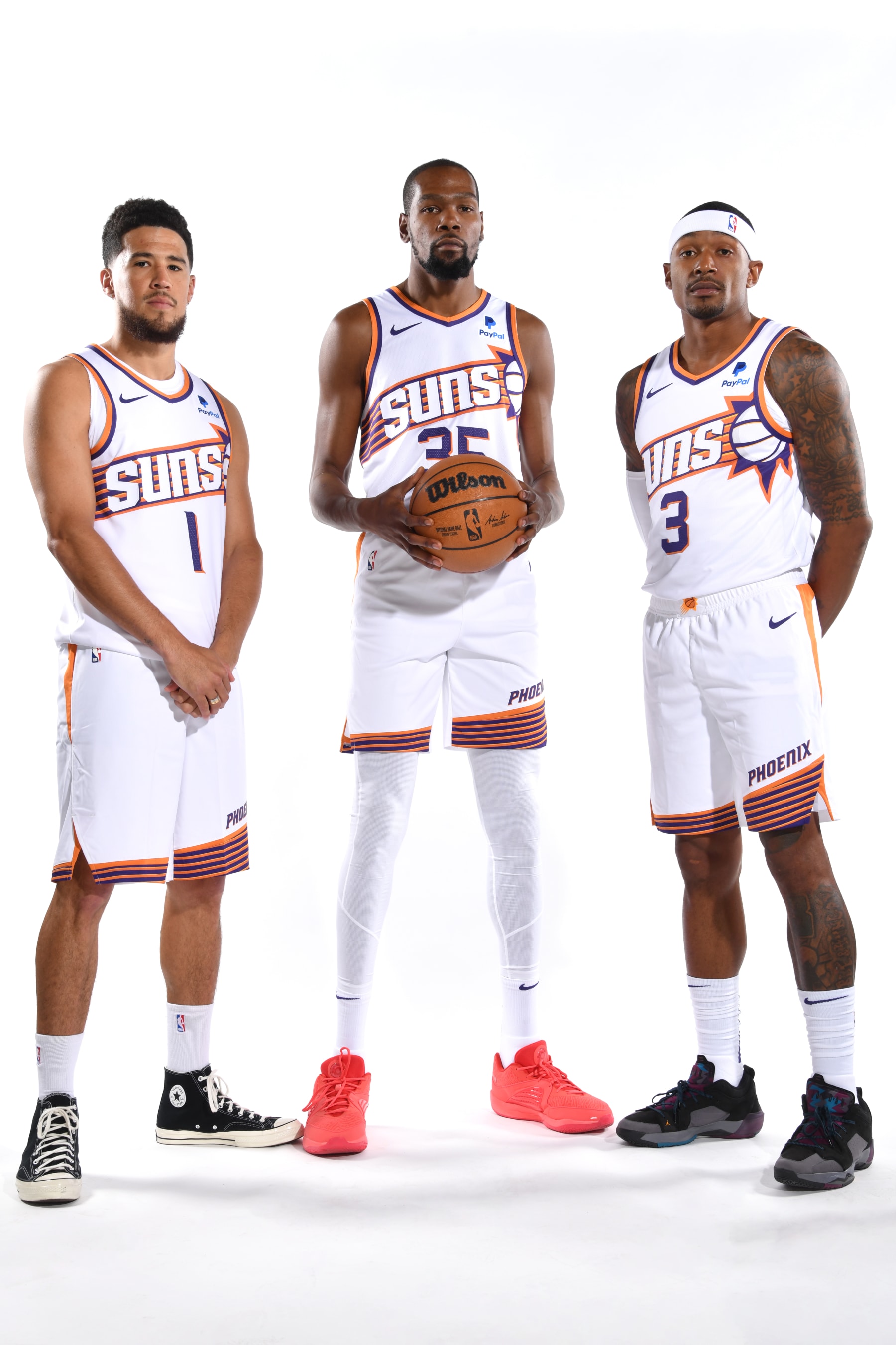 PHOENIX, AZ - OCTOBER 02: Devin Booker #1, Kevin Durant #35 and Bradley Beal #3 of the Phoenix Suns  poses for a portrait during 2023-24 NBA Media Day on October 2, 2023, at the Footprint Center in Phoenix, Arizona. NOTE TO USER: User expressly acknowledges and agrees that, by downloading and or using this Photograph, user is consenting to the terms and conditions of the Getty Images License Agreement. Mandatory Copyright Notice: Copyright 2023 NBAE (Photo by Barry Gossage / NBAE via Getty Images)