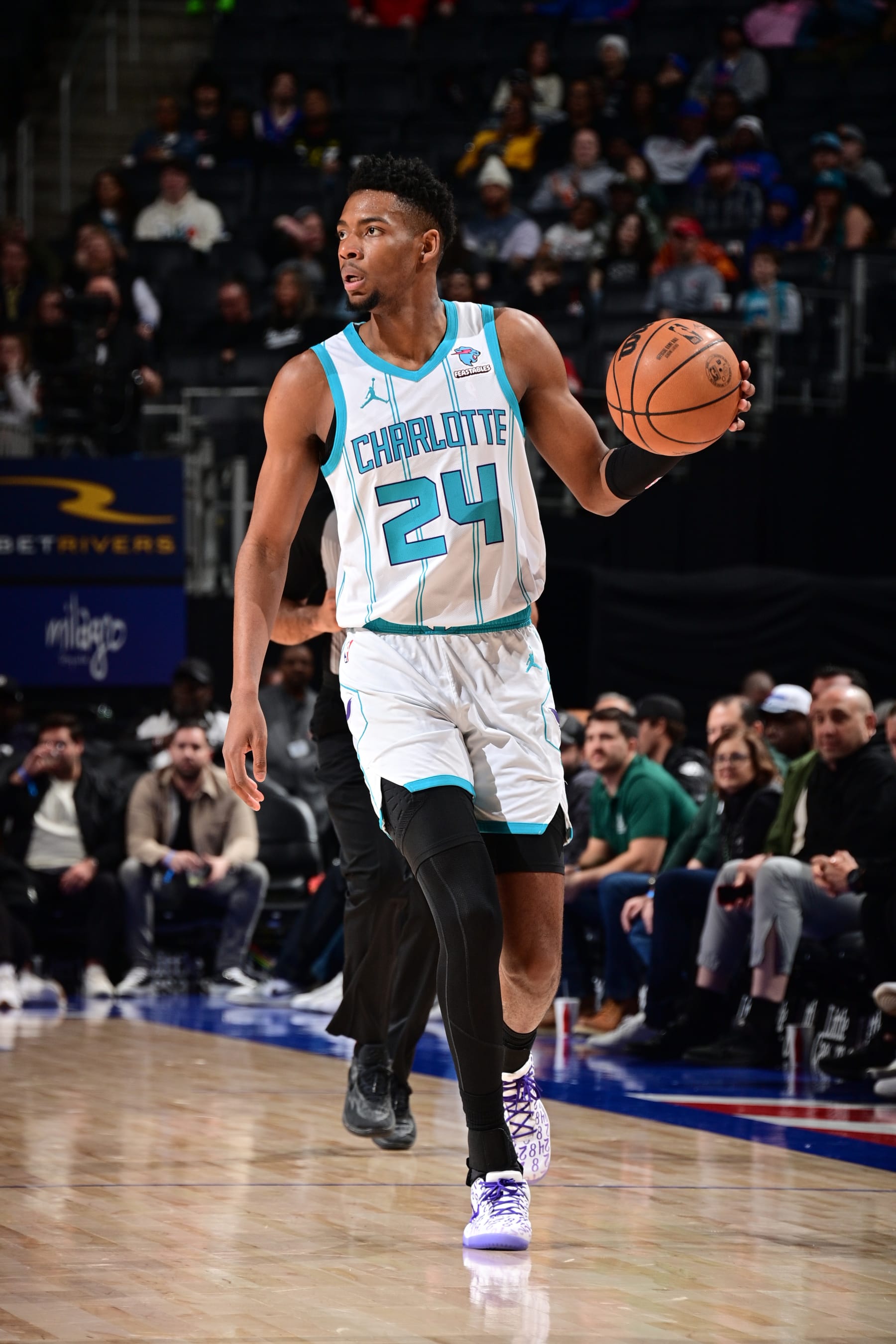 DETROIT, MI - MARCH 11:  Brandon Miller #24 of the Charlotte Hornets dribbles the ball during the game against the Detroit Pistons on March 11, 2024 at Little Caesars Arena in Detroit, Michigan. NOTE TO USER: User expressly acknowledges and agrees that, by downloading and/or using this photograph, User is consenting to the terms and conditions of the Getty Images License Agreement. Mandatory Copyright Notice: Copyright 2024 NBAE (Photo by Chris Schwegler/NBAE via Getty Images)
