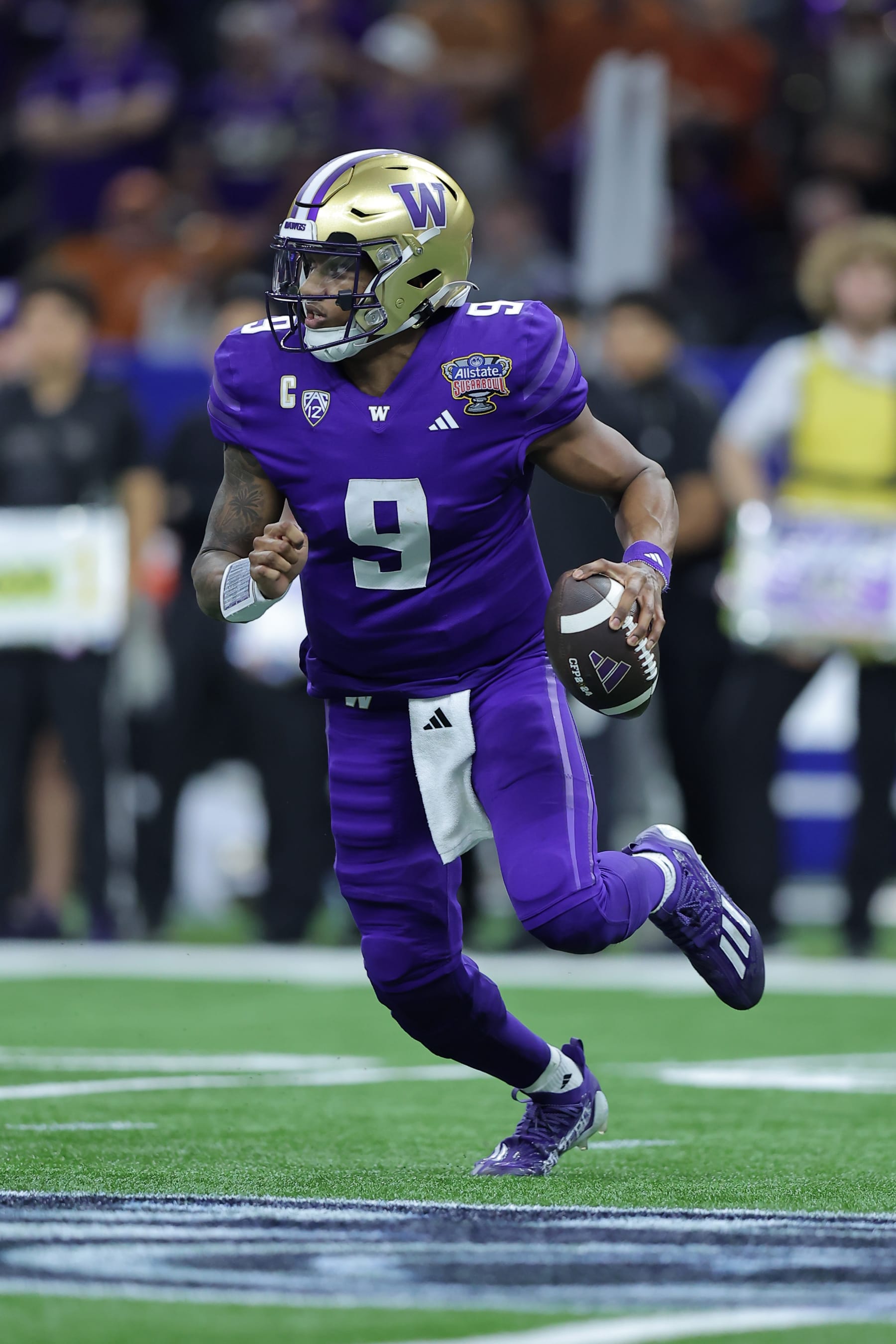NEW ORLEANS, LOUISIANA - JANUARY 01: Michael Penix Jr. #9 of the Washington Huskies throws the ball against the Texas Longhorns during the CFP Semifinal Allstate Sugar Bowl at Caesars Superdome on January 01, 2024 in New Orleans, Louisiana. (Photo by Jonathan Bachman/Getty Images)