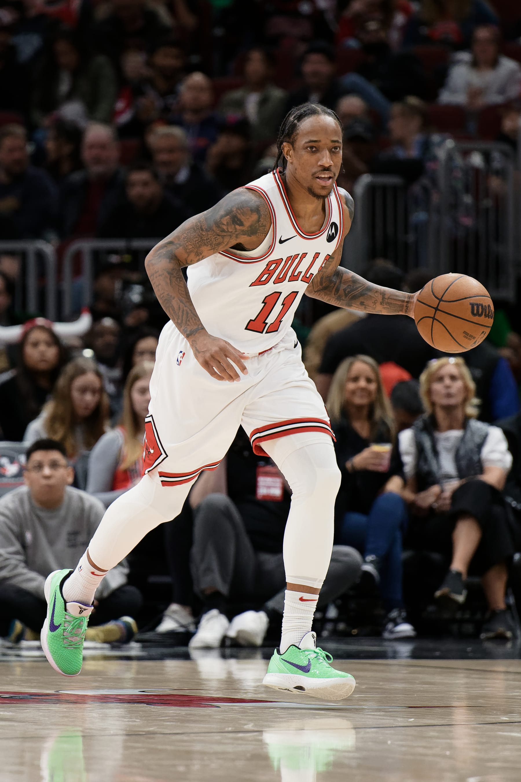 CHICAGO, ILLINOIS - MARCH 16:  DeMar DeRozan #11 of the Chicago Bulls controls the ball against the Washington Wizards on March 16, 2024 at United Center in Chicago, Illinois. Chicago defeated Washington 127-98.   NOTE TO USER: User expressly acknowledges and agrees that, by downloading and or using this photograph, User is consenting to the terms and conditions of the Getty Images License Agreement.  (Photo by Jamie Sabau/Getty Images)
