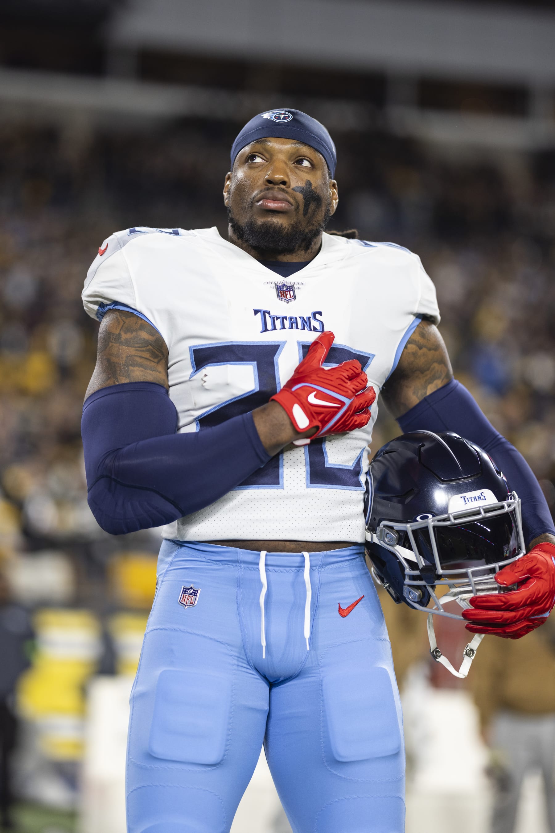 PITTSBURGH, PENNSYLVANIA - NOVEMBER 02: Derrick Henry #22 of the Tennessee Titans looks on during the national anthem prior to an NFL football game between the Pittsburgh Steelers and the Tennessee Titans at Acrisure Stadium on November 02, 2023 in Pittsburgh, Pennsylvania. (Photo by Michael Owens/Getty Images)