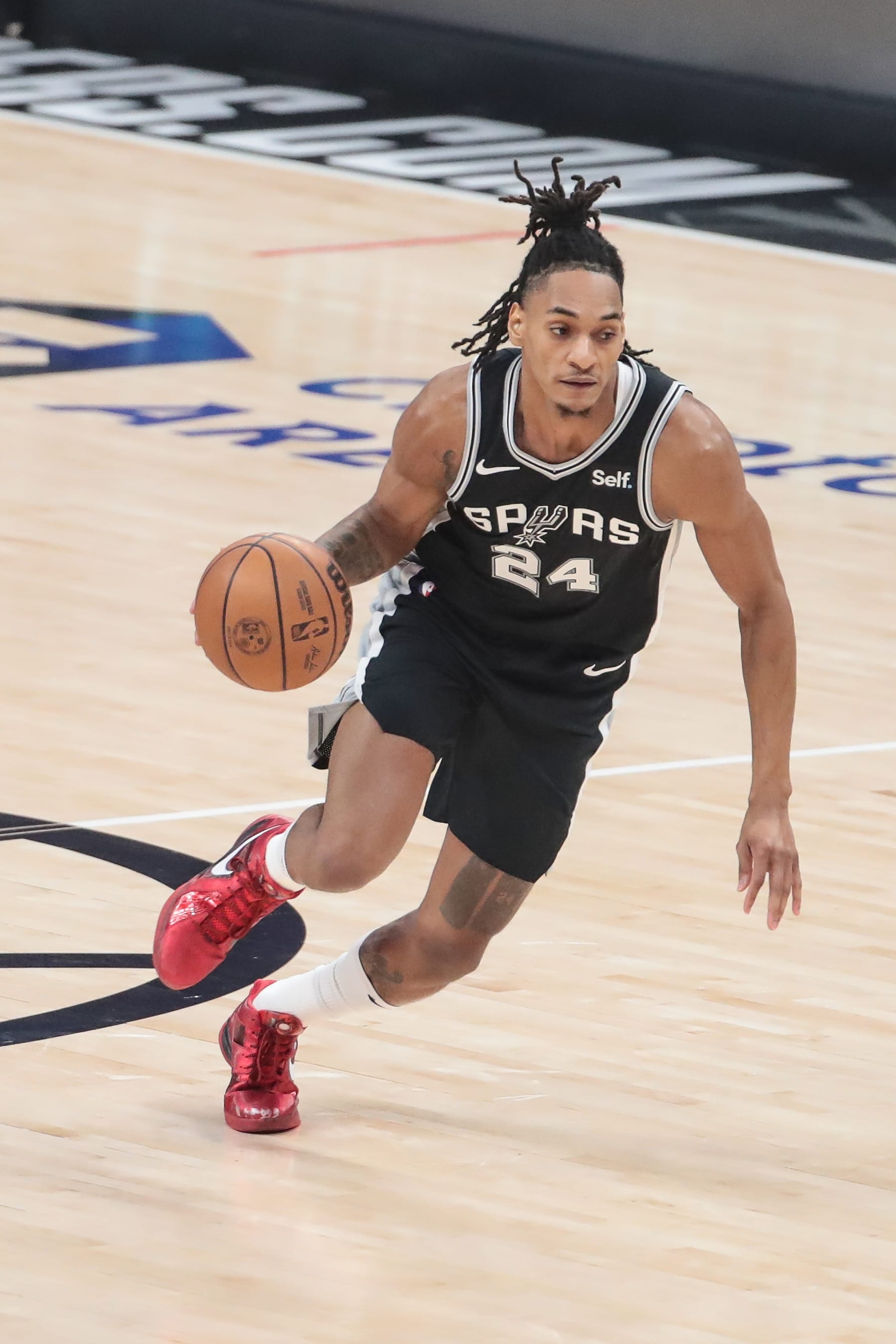 LOS ANGELES, CA - OCTOBER 29: San Antonio Spurs guard Devin Vassell (24) dribbles during the San Antonio Spurs game versus the Los Angeles Clippers on October 29, 2023, at Crypto.com Arena in Los Angeles, CA. (Photo by Jevone Moore/Icon Sportswire via Getty Images)