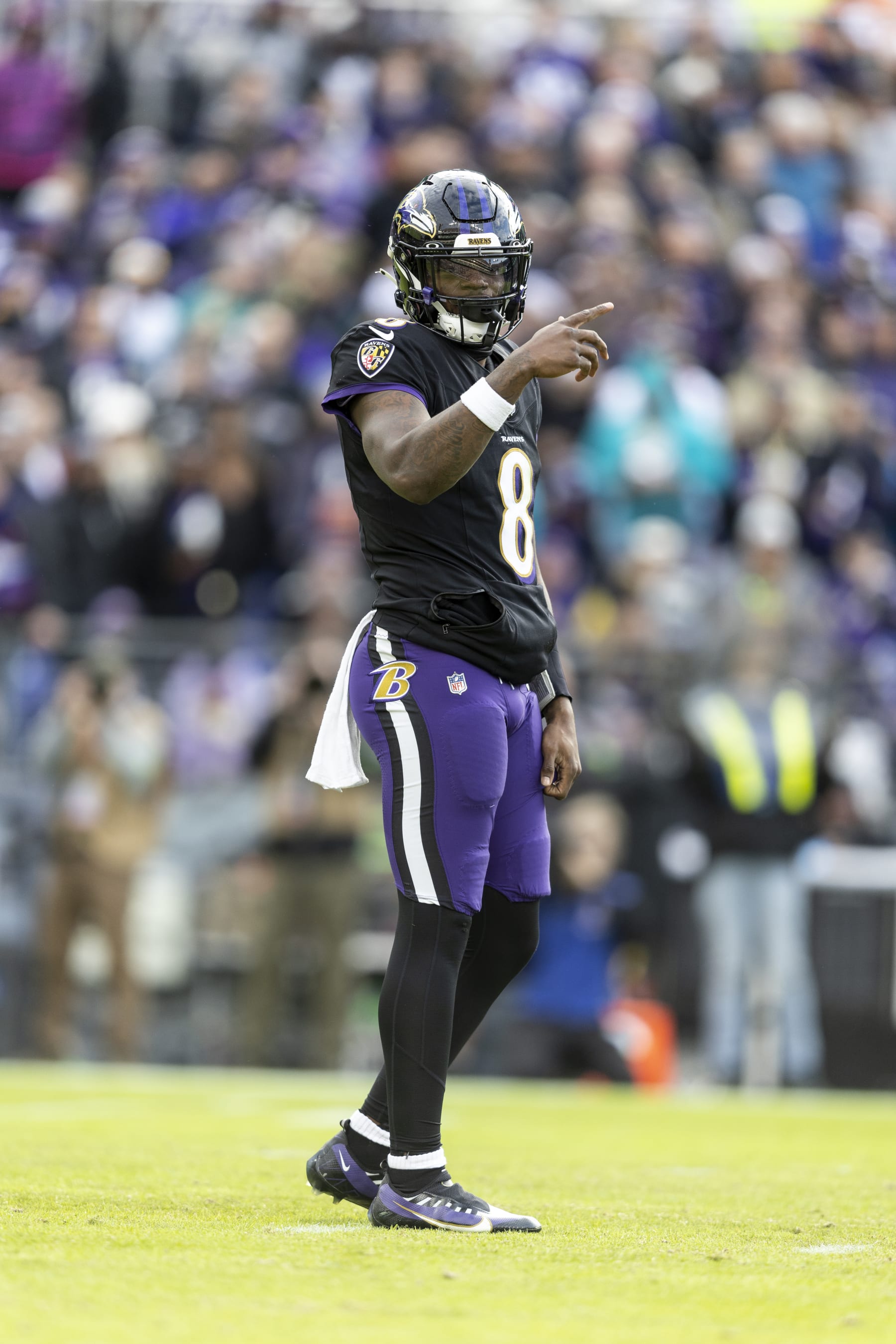 BALTIMORE, MARYLAND - DECEMBER 31: Lamar Jackson #8 of the Baltimore Ravens signals during an NFL football game between the Baltimore Ravens and the Miami Dolphins at M&T Bank Stadium on December 31, 2023 in Baltimore, Maryland. (Photo by Michael Owens/Getty Images)