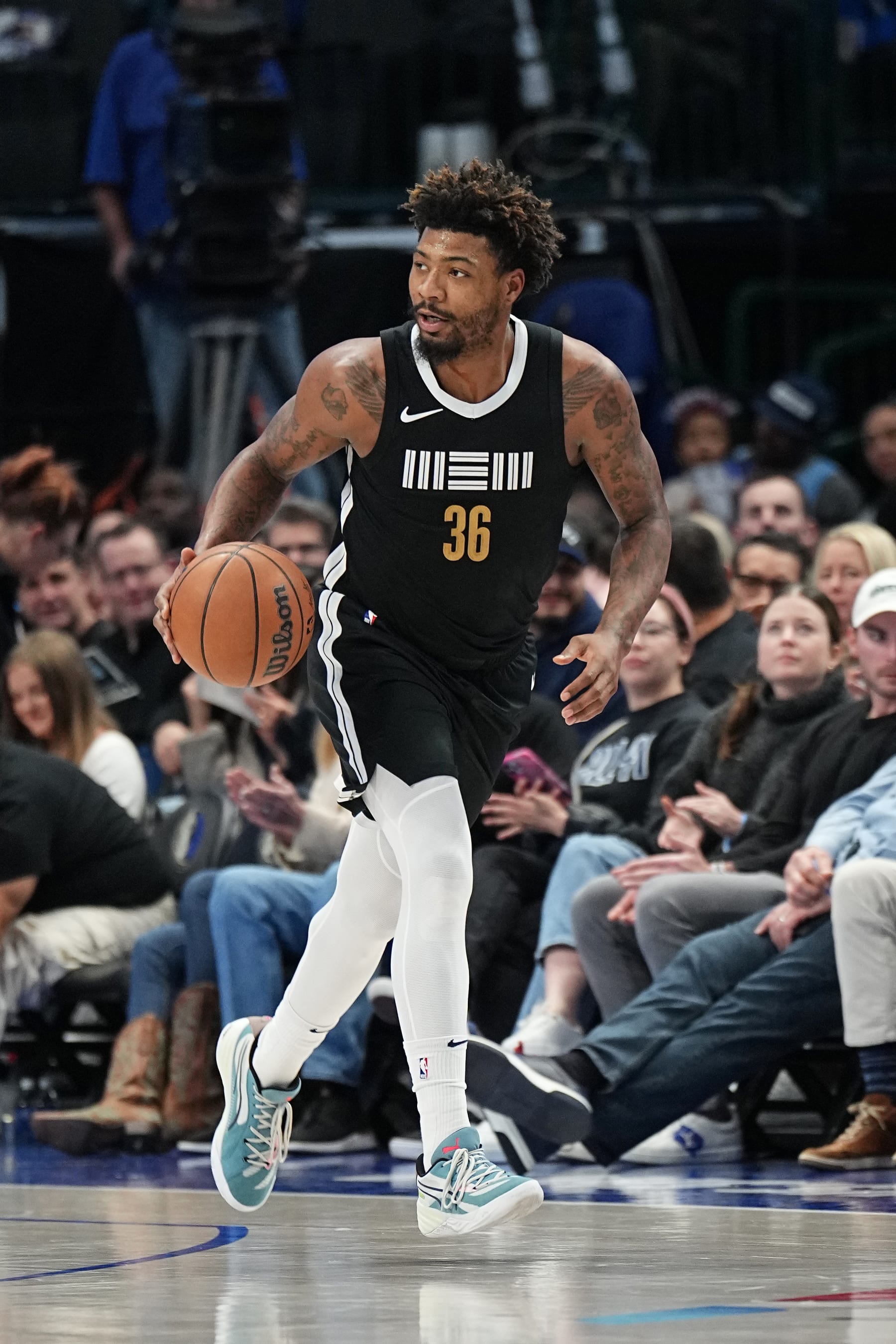 DALLAS, TX - JANUARY 9: Marcus Smart #36 of the Memphis Grizzlies dribbles the ball during the game against the Dallas Mavericks on January 9, 2024 at the American Airlines Center in Dallas, Texas. NOTE TO USER: User expressly acknowledges and agrees that, by downloading and or using this photograph, User is consenting to the terms and conditions of the Getty Images License Agreement. Mandatory Copyright Notice: Copyright 2024 NBAE (Photo by Glenn James/NBAE via Getty Images)