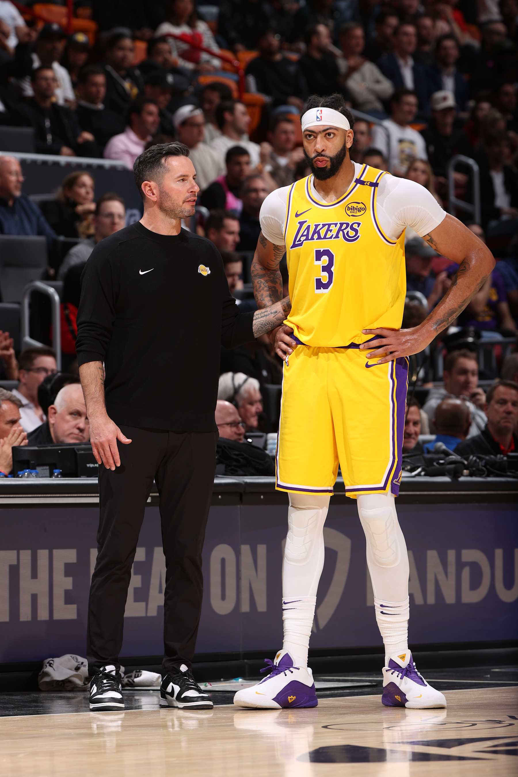 MIAMI, FL - DECEMBER 4:  Head Coach JJ Redick of the Los Angeles Lakers talks to Anthony Davis #3 of the Los Angeles Lakers during the game against the Miami Heat on December 4, 2024 at Kaseya Center in Miami, Florida. NOTE TO USER: User expressly acknowledges and agrees that, by downloading and or using this Photograph, user is consenting to the terms and conditions of the Getty Images License Agreement. Mandatory Copyright Notice: Copyright 2024 NBAE (Photo by Joe Murphy/NBAE via Getty Images)