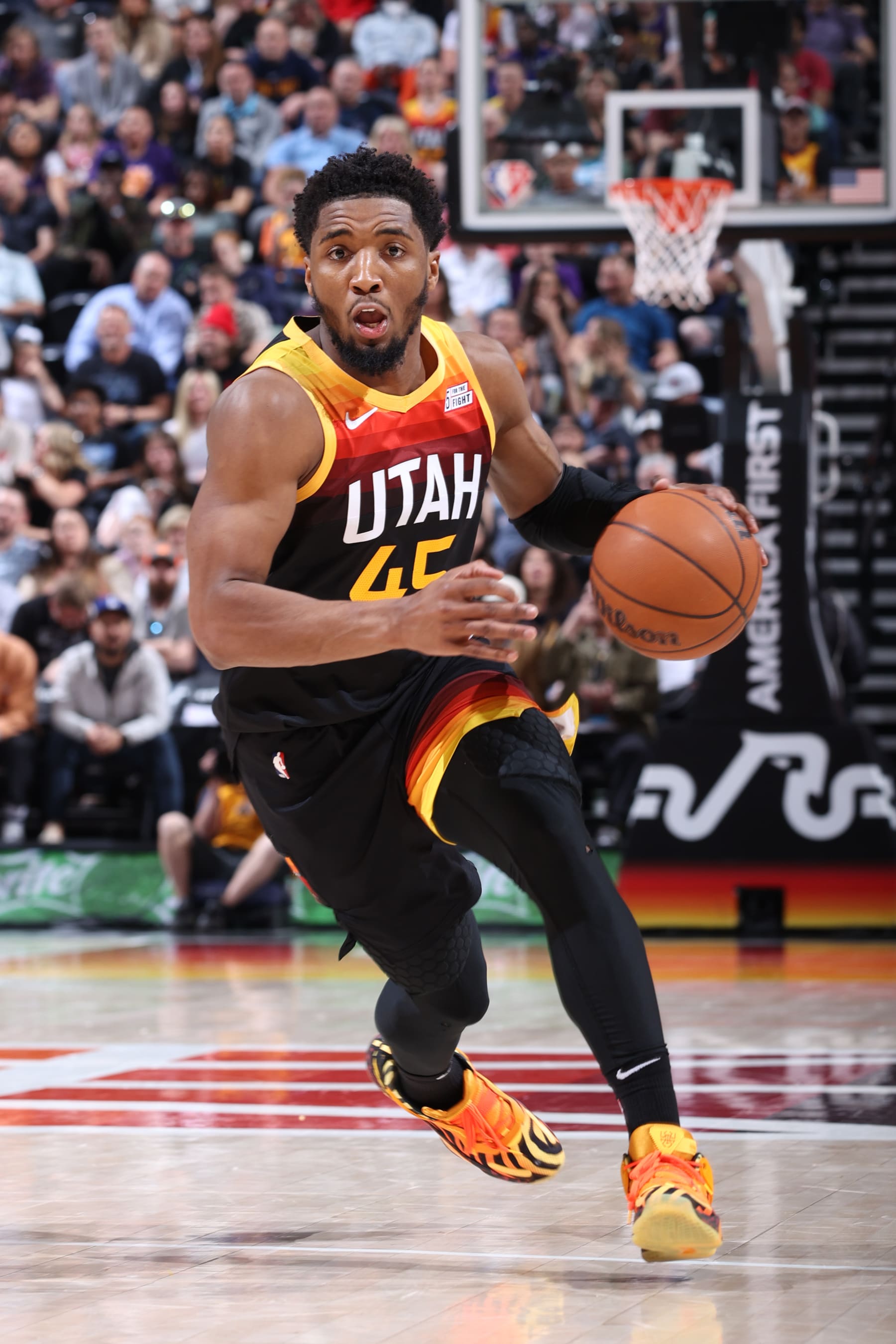 SALT LAKE CITY, UT - APRIL 8: Donovan Mitchell #45 of the Utah Jazz drives to the basket during the game against the Phoenix Suns on April 8, 2022 at vivint.SmartHome Arena in Salt Lake City, Utah. NOTE TO USER: User expressly acknowledges and agrees that, by downloading and or using this Photograph, User is consenting to the terms and conditions of the Getty Images License Agreement. Mandatory Copyright Notice: Copyright 2022 NBAE (Photo by Melissa Majchrzak/NBAE via Getty Images)
