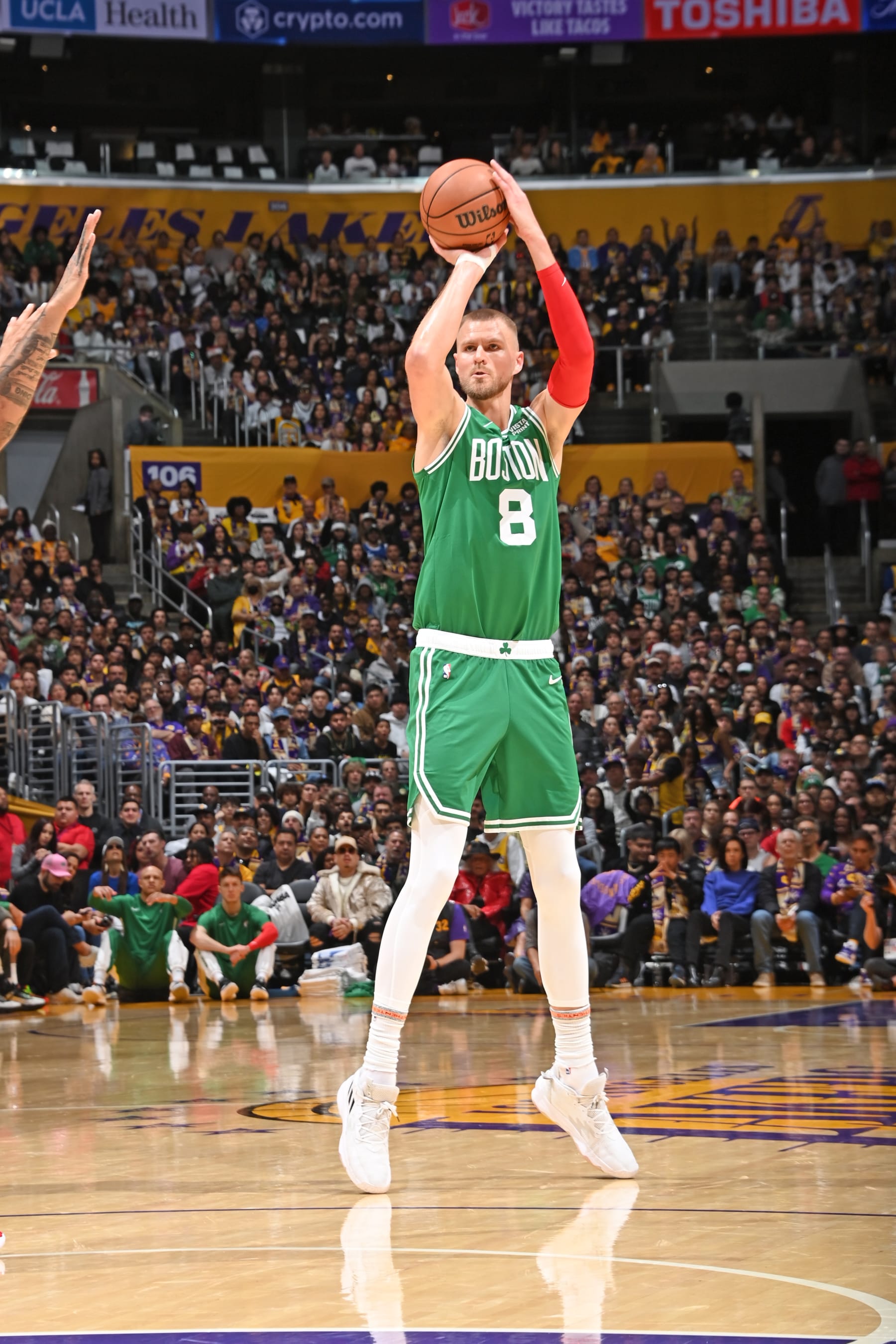 LOS ANGELES, CA - DECEMBER 25: Kristaps Porzingis #8 of the Boston Celtics shoots a three point basket during the game against the Los Angeles Lakers on December 25, 2023 at Crypto.Com Arena in Los Angeles, California. NOTE TO USER: User expressly acknowledges and agrees that, by downloading and/or using this Photograph, user is consenting to the terms and conditions of the Getty Images License Agreement. Mandatory Copyright Notice: Copyright 2023 NBAE (Photo by Andrew D. Bernstein/NBAE via Getty Images)