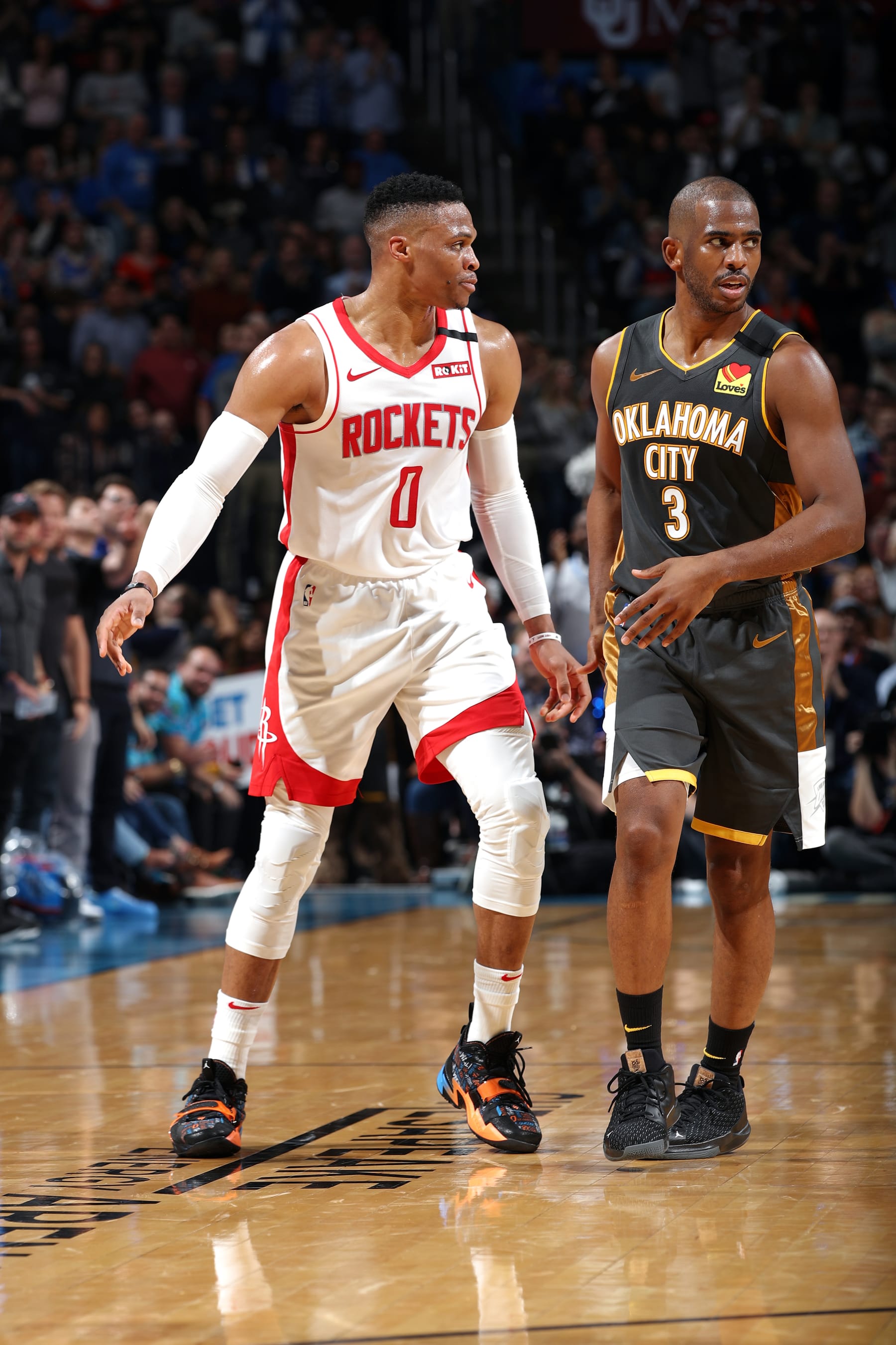 OKLAHOMA CITY, OK - JANUARY 9: Russell Westbrook #0 of the Houston Rockets and Chris Paul #3 of the Oklahoma City Thunder look on during the game on January 9, 2020 at Chesapeake Energy Arena in Oklahoma City, Oklahoma. NOTE TO USER: User expressly acknowledges and agrees that, by downloading and or using this photograph, User is consenting to the terms and conditions of the Getty Images License Agreement. Mandatory Copyright Notice: Copyright 2020 NBAE (Photo by Zach Beeker/NBAE via Getty Images)