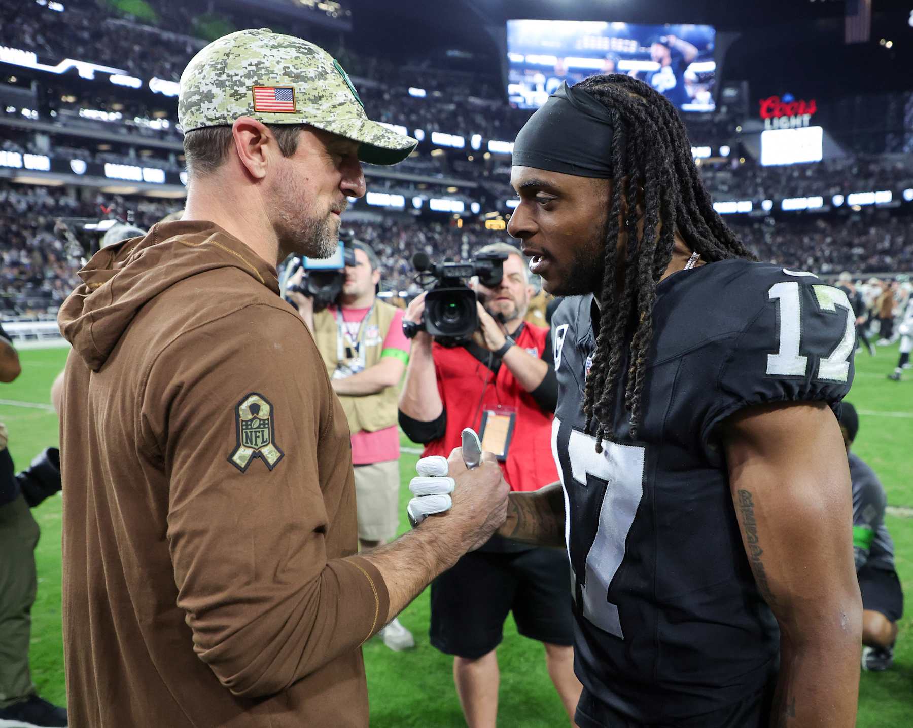 LAS VEGAS, NEVADA - NOVEMBER 12: Quarterback Aaron Rodgers #8 of the New York Jets and wide receiver Davante Adams #17 of the Las Vegas Raiders visit on the field after the Raiders' 16-12 victory over the Jets at Allegiant Stadium on November 12, 2023 in Las Vegas, Nevada. (Photo by Ethan Miller/Getty Images)