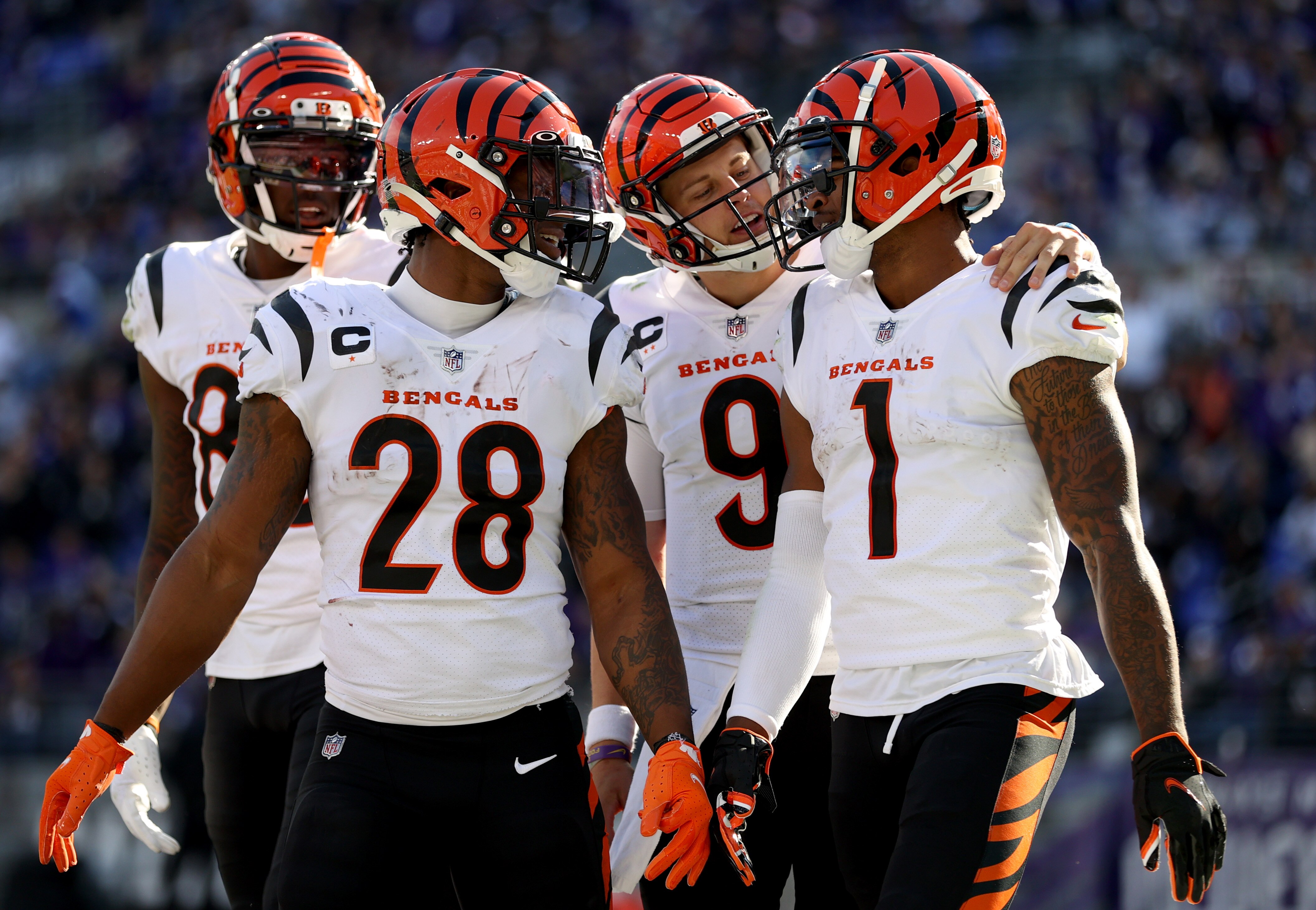 BALTIMORE, MARYLAND - OCTOBER 24: Ja'Marr Chase #1 of the Cincinnati Bengals celebrates a touchdown with Joe Burrow #9 and Joe Mixon #28 during the second half in the game against the Baltimore Ravens at M&T Bank Stadium on October 24, 2021 in Baltimore, Maryland. (Photo by Rob Carr/Getty Images)