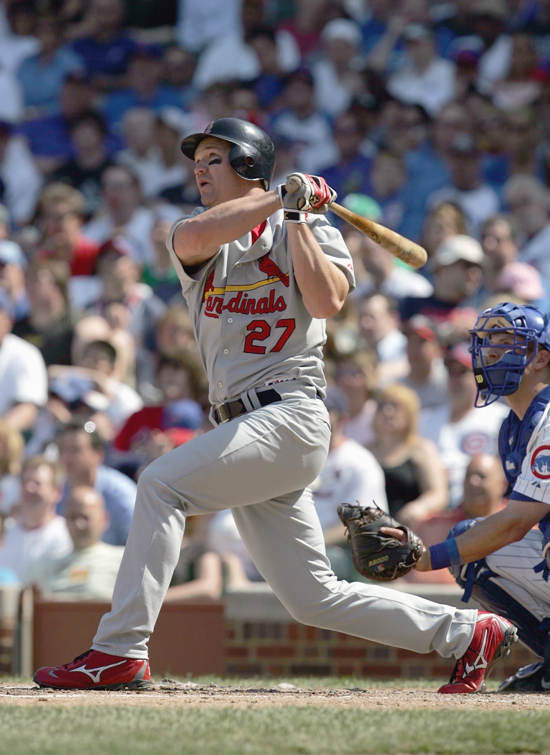 CHICAGO - APRIL 22: Scott Rolen #27 of the St. Louis Cardinals makes a hit against the Chicago Cubs on April 22, 2007 at Wrigley Field in Chicago, Illinois. (Photo by Jonathan Daniel/Getty Images)