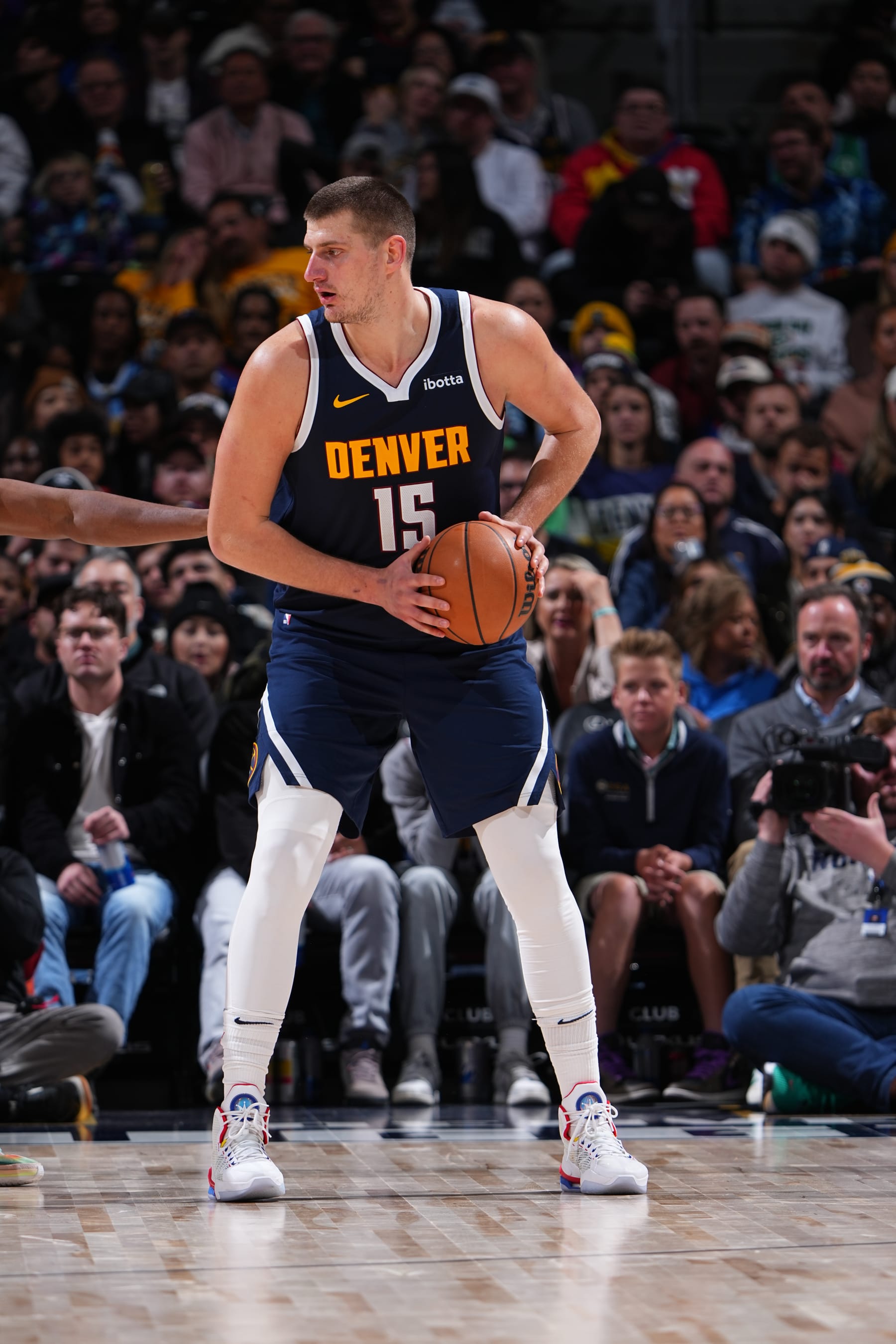 DENVER, CO - NOVEMBER 26: Nikola Jokic #15 of the Denver Nuggets looks to pass the ball during the game against the San Antonio Spurs on November 26, 2023 at the Ball Arena in Denver, Colorado. NOTE TO USER: User expressly acknowledges and agrees that, by downloading and/or using this Photograph, user is consenting to the terms and conditions of the Getty Images License Agreement. Mandatory Copyright Notice: Copyright 2023 NBAE (Photo by Garrett Ellwood/NBAE via Getty Images)