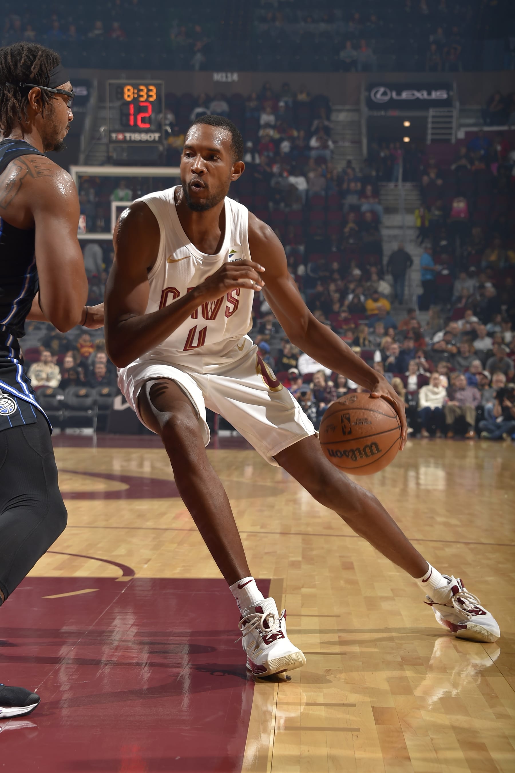 CLEVELAND, OH - OCTOBER 12: Evan Mobley #4 of the Cleveland Cavaliers drives to the basket during the game against the Orlando Magic on October 12, 2023 at Rocket Mortgage FieldHouse in Cleveland, Ohio. NOTE TO USER: User expressly acknowledges and agrees that, by downloading and/or using this Photograph, user is consenting to the terms and conditions of the Getty Images License Agreement. Mandatory Copyright Notice: Copyright 2023 NBAE (Photo by David Liam Kyle/NBAE via Getty Images)