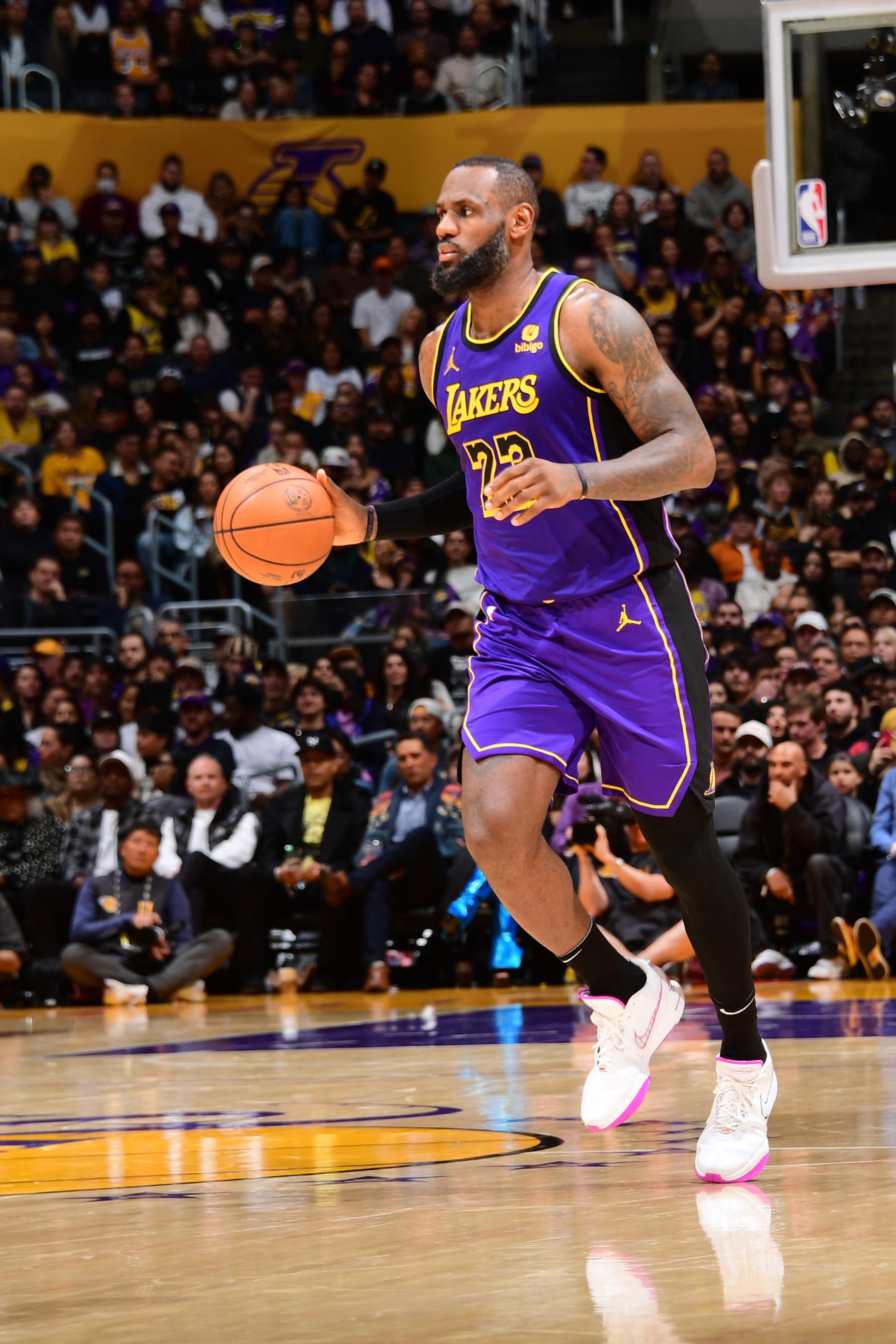 LOS ANGELES, CA - JANUARY 19:  LeBron James #23 of the Los Angeles Lakers handles the ball during the game  on January 19, 2024 at Crypto.Com Arena in Los Angeles, California. NOTE TO USER: User expressly acknowledges and agrees that, by downloading and/or using this Photograph, user is consenting to the terms and conditions of the Getty Images License Agreement. Mandatory Copyright Notice: Copyright 2024 NBAE (Photo by Adam Pantozzi/NBAE via Getty Images)