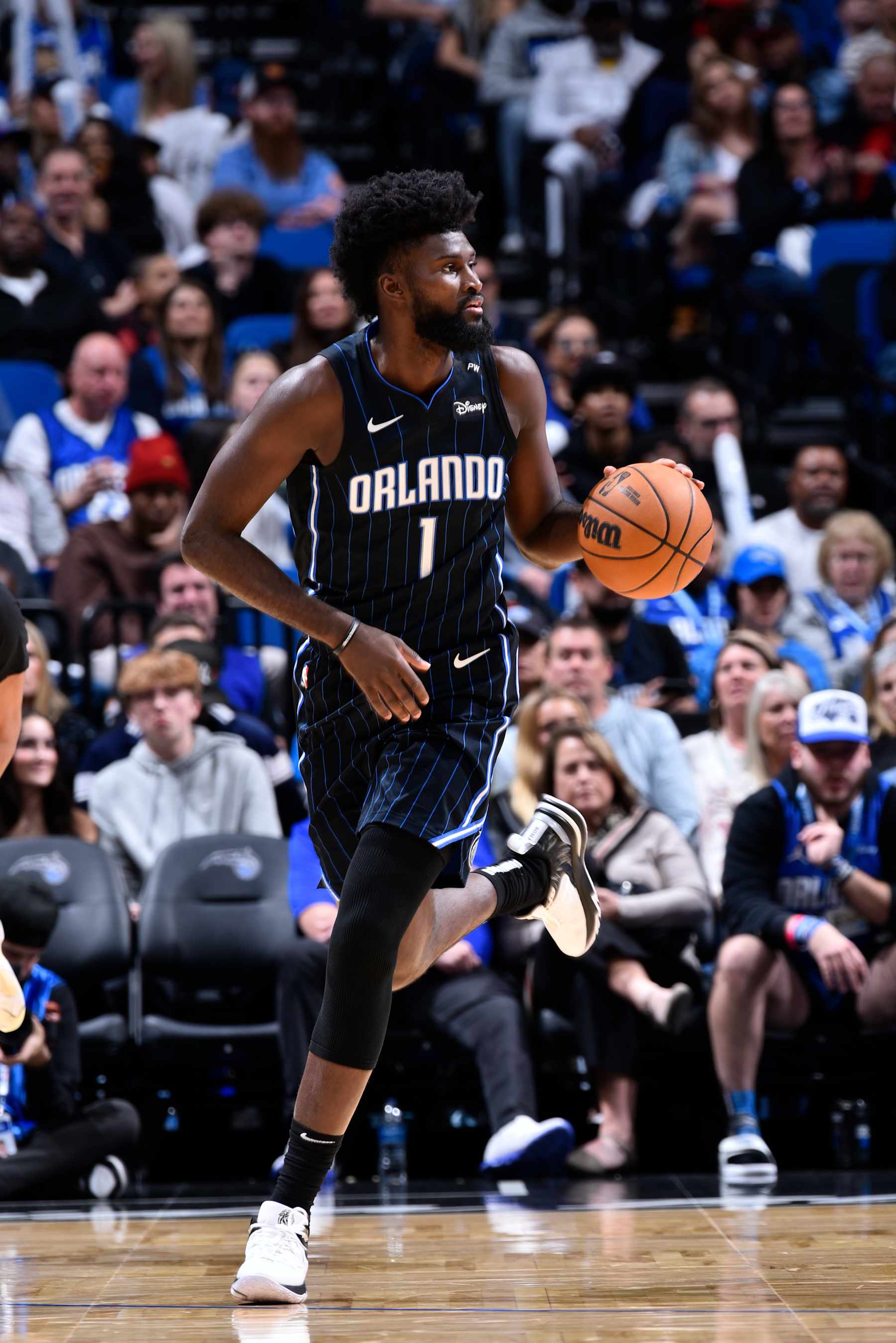 ORLANDO, FL - JANUARY 5 :  Jonathan Isaac #1 of the Orlando Magic dribbles the ball during the game against the Utah Jazz on January 5, 2025 at Kia Center in Orlando, Florida. NOTE TO USER: User expressly acknowledges and agrees that, by downloading and or using this photograph, User is consenting to the terms and conditions of the Getty Images License Agreement. Mandatory Copyright Notice: Copyright 2025 NBAE (Photo by Gary Bassing/NBAE via Getty Images)
