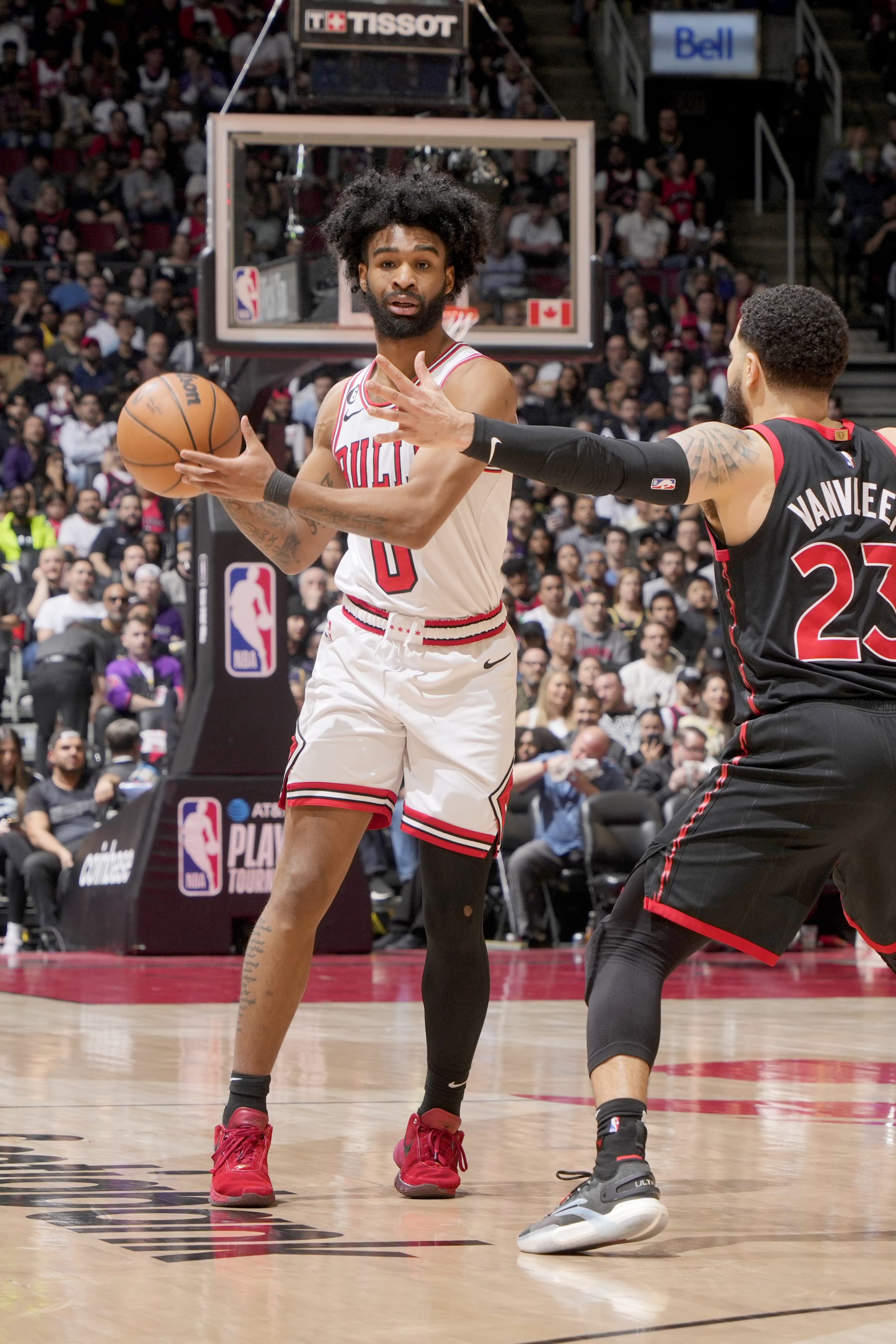 TORONTO, CANADA - APRIL 12:  Coby White #0 of the Chicago Bulls looks to pass the ball during the game against the Toronto Raptors during the 2023 Play-In Tournament on April 12, 2023 at the Scotiabank Arena in Toronto, Ontario, Canada.  NOTE TO USER: User expressly acknowledges and agrees that, by downloading and or using this Photograph, user is consenting to the terms and conditions of the Getty Images License Agreement.  Mandatory Copyright Notice: Copyright 2022 NBAE (Photo by Mark Blinch/NBAE via Getty Images)