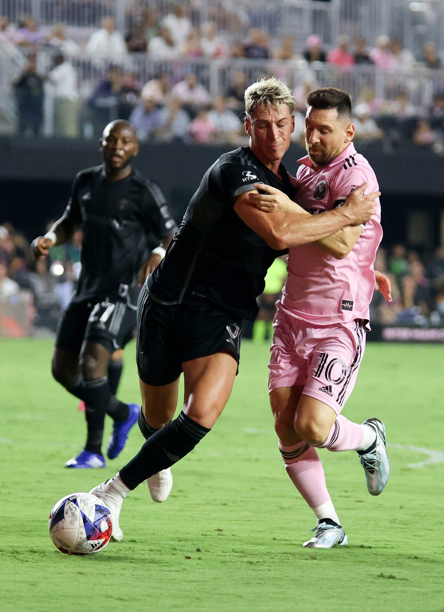 Inter Miami's Argentine forward #10 Lionel Messi vies for the ball with Nashville's US defender #03 Lukas MacNaughton (L) during the Major League Soccer (MLS) football match between Inter Miami CF and Nashville SC at DRV PNK Stadium in Fort Lauderdale, Florida, on August 30, 2023. (Photo by Chris Arjoon / AFP) (Photo by CHRIS ARJOON/AFP via Getty Images)