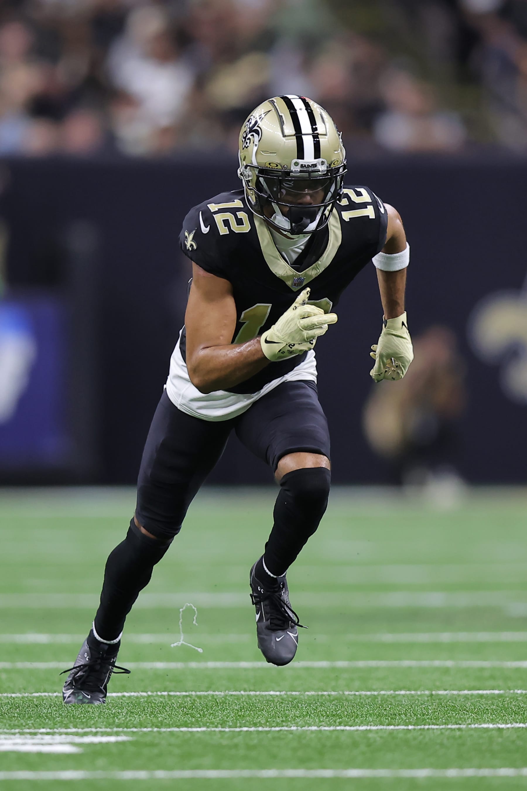 NEW ORLEANS, LOUISIANA - OCTOBER 19: Chris Olave #12 of the New Orleans Saints in action against the Jacksonville Jaguars during a game at the Caesars Superdome on October 19, 2023 in New Orleans, Louisiana. (Photo by Jonathan Bachman/Getty Images)