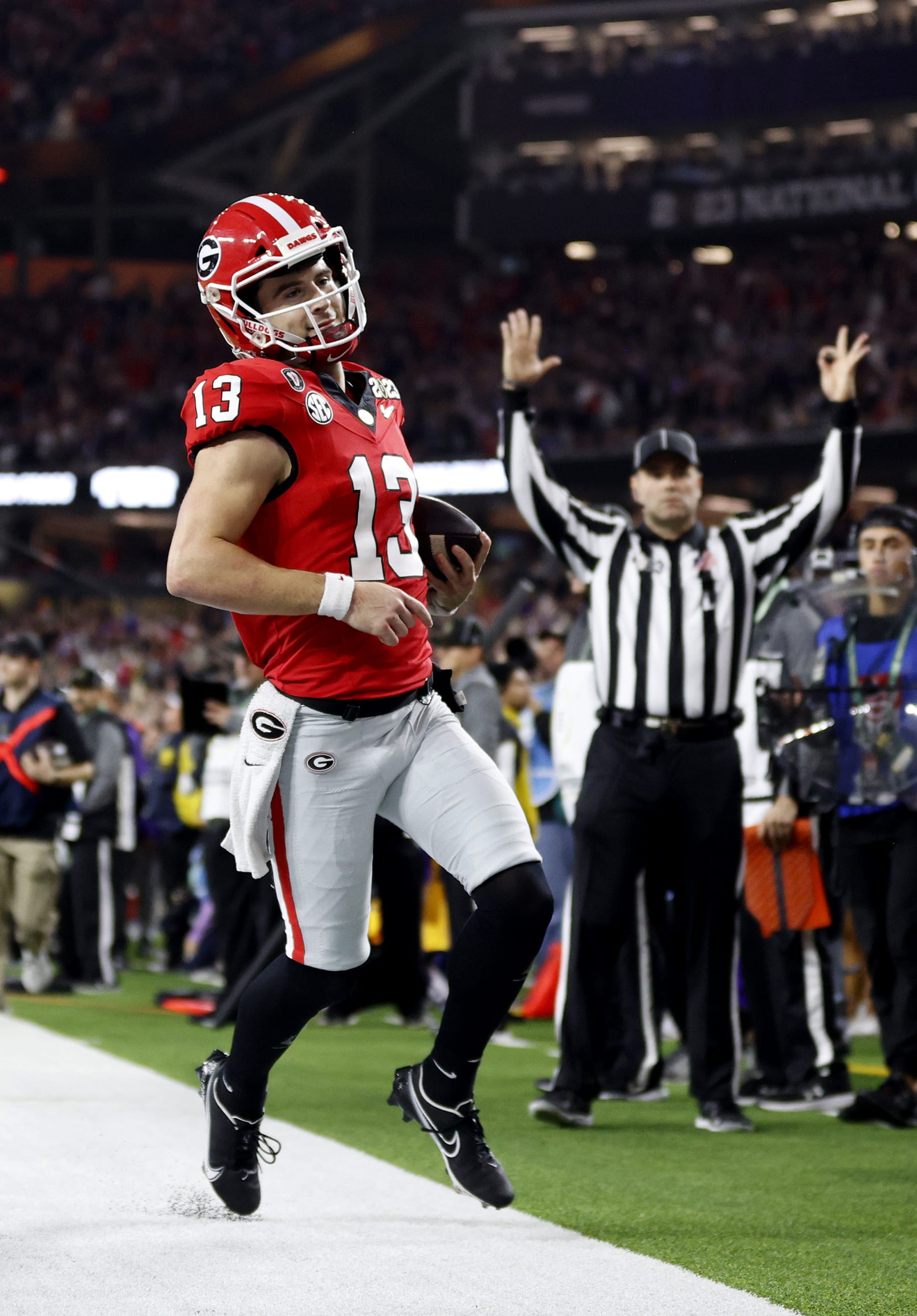 INGLEWOOD, CALIFORNIA - JANUARY 09: Stetson Bennett #13 of the Georgia Bulldogs runs for a touchdown in the second quarter against the TCU Horned Frogs in the College Football Playoff National Championship game at SoFi Stadium on January 09, 2023 in Inglewood, California. (Photo by Steph Chambers/Getty Images)