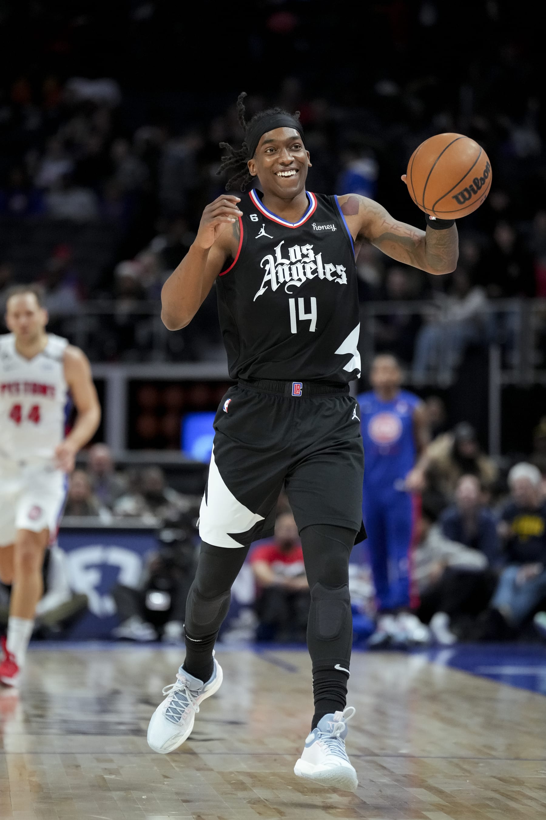 DETROIT, MICHIGAN - DECEMBER 26: Terance Mann #14 of the LA Clippers smiles and handles the ball against the Detroit Pistons at Little Caesars Arena on December 26, 2022 in Detroit, Michigan. NOTE TO USER: User expressly acknowledges and agrees that, by downloading and or using this photograph, User is consenting to the terms and conditions of the Getty Images License Agreement. (Photo by Nic Antaya/Getty Images)