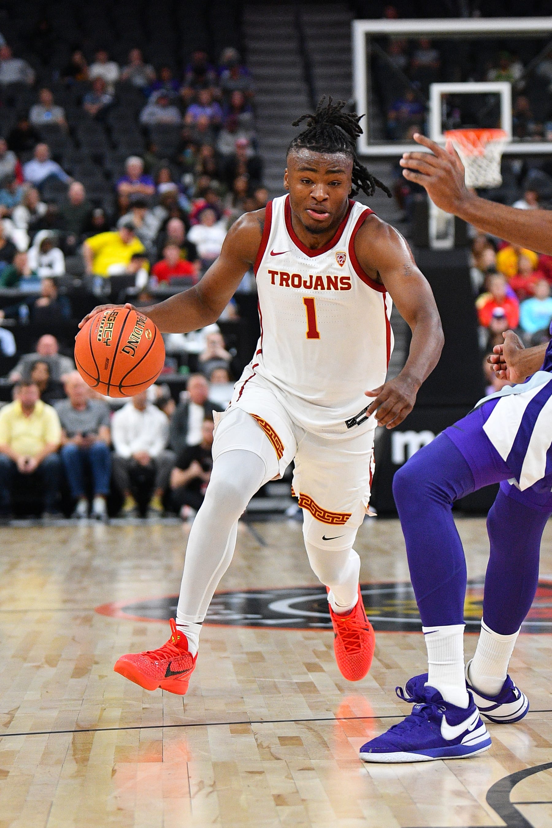 LAS VEGAS, NV - NOVEMBER 06: USC Trojans guard Isaiah Collier (1) drives to the basket during the Hall of Fame Series, a college basketball game between the Kansas State Wildcats and the USC Trojans on November 6, 2023 at T-Mobile Arena in Las Vegas, NV. (Photo by Brian Rothmuller/Icon Sportswire via Getty Images)
