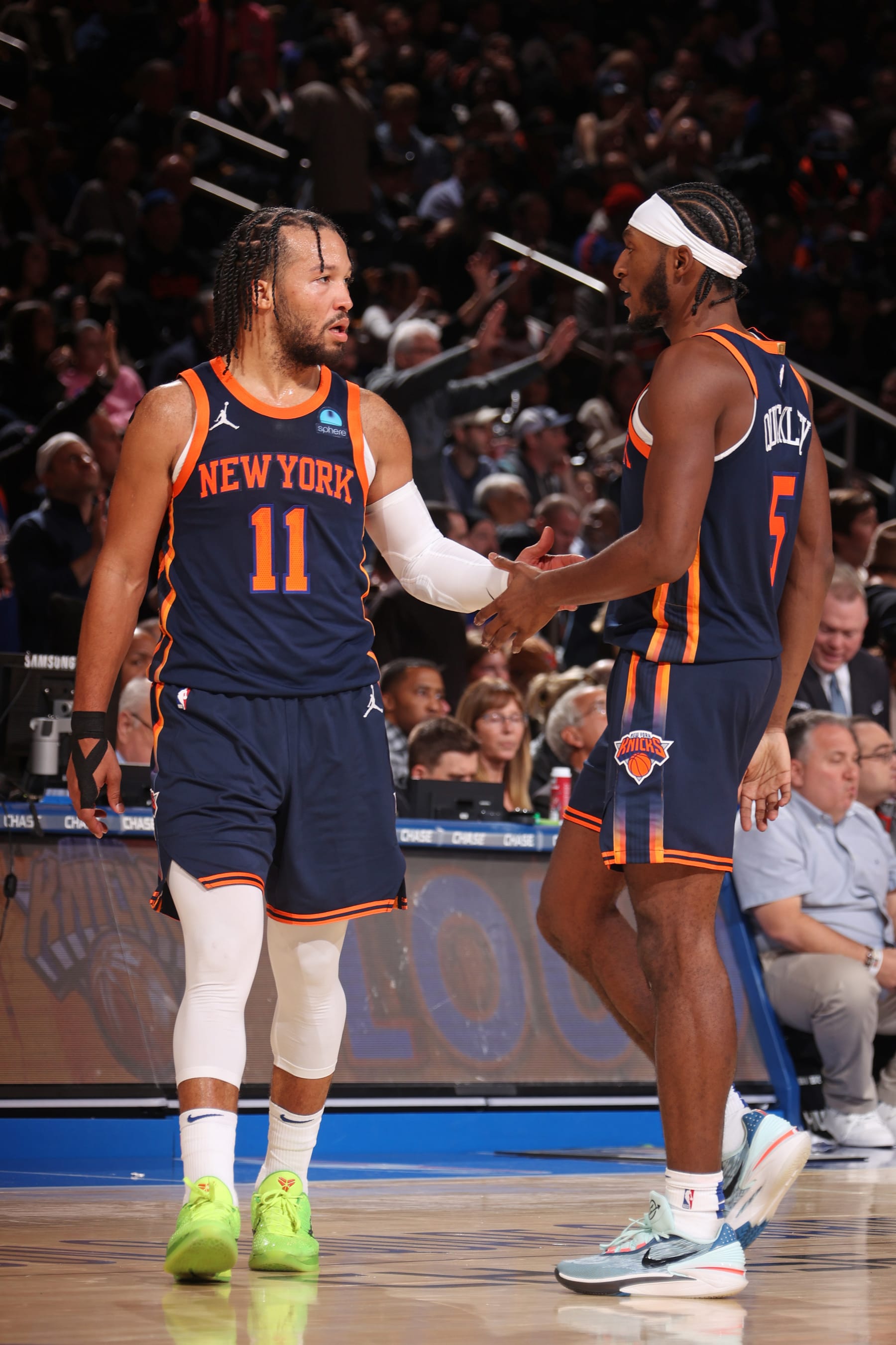 NEW YORK, NY - NOVEMBER 26: Jalen Brunson #11 and Immanuel Quickley #5 of the New York Knicks high five during the game against the Phoenix Suns on November 26, 2023 at Madison Square Garden in New York City, New York.  NOTE TO USER: User expressly acknowledges and agrees that, by downloading and or using this photograph, User is consenting to the terms and conditions of the Getty Images License Agreement. Mandatory Copyright Notice: Copyright 2023 NBAE  (Photo by Nathaniel S. Butler/NBAE via Getty Images)