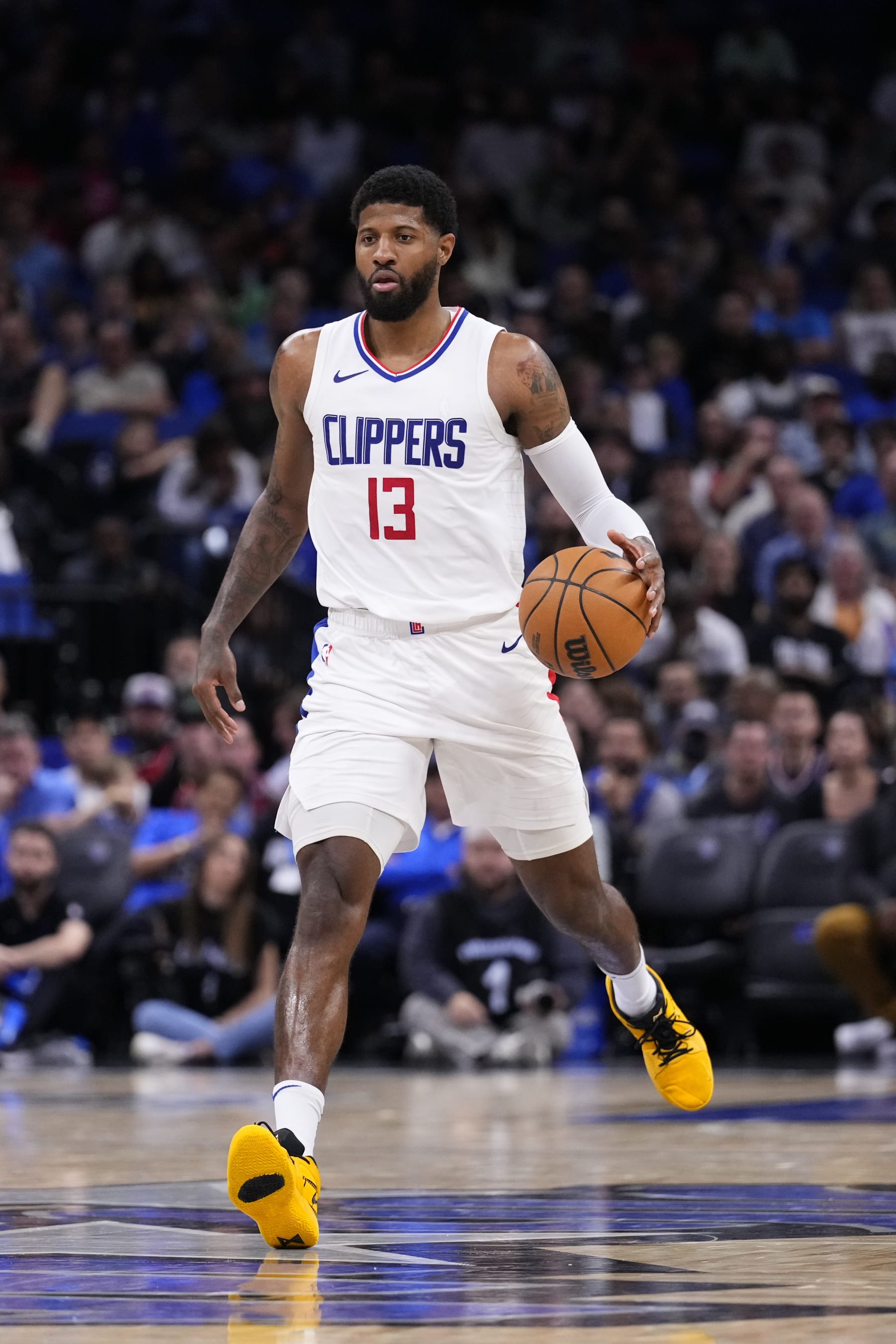 ORLANDO, FLORIDA - MARCH 29: Paul George #13 of the LA Clippers dribbles the ball against the Orlando Magic during the fourth quarter at Kia Center on March 29, 2024 in Orlando, Florida. NOTE TO USER: User expressly acknowledges and agrees that, by downloading and or using this photograph, User is consenting to the terms and conditions of the Getty Images License Agreement. (Photo by Rich Storry/Getty Images)