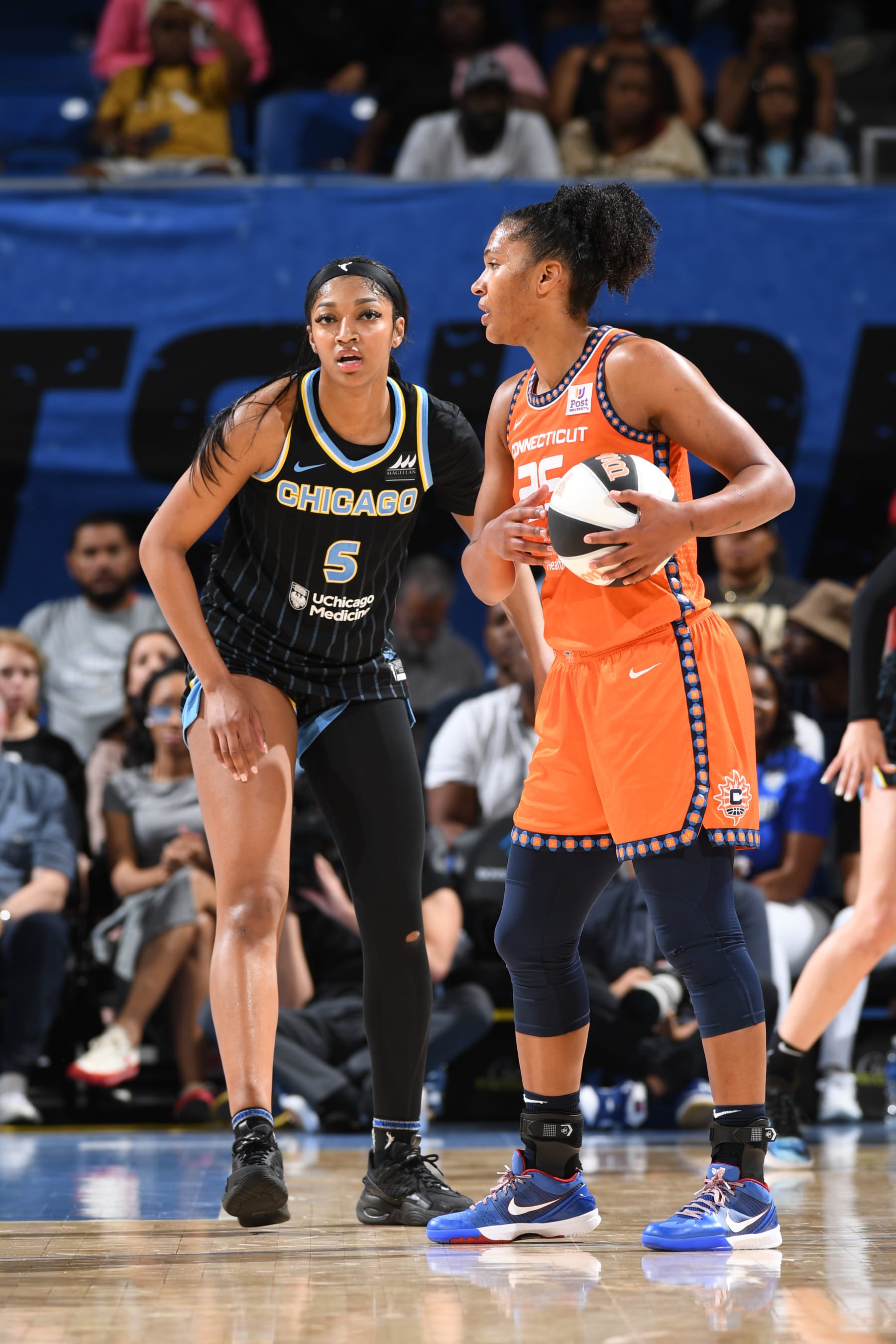 CHICAGO, IL -  JUNE 12: Angel Reese #5 of the Chicago Sky plays defense against Alyssa Thomas #25 of the Connecticut Sun during the game on June 12, 2024 at the Wintrust Arena in Chicago, IL. NOTE TO USER: User expressly acknowledges and agrees that, by downloading and or using this photograph, User is consenting to the terms and conditions of the Getty Images License Agreement. Mandatory Copyright Notice: Copyright 2024 NBAE (Photo by Randy Belice/NBAE via Getty Images)