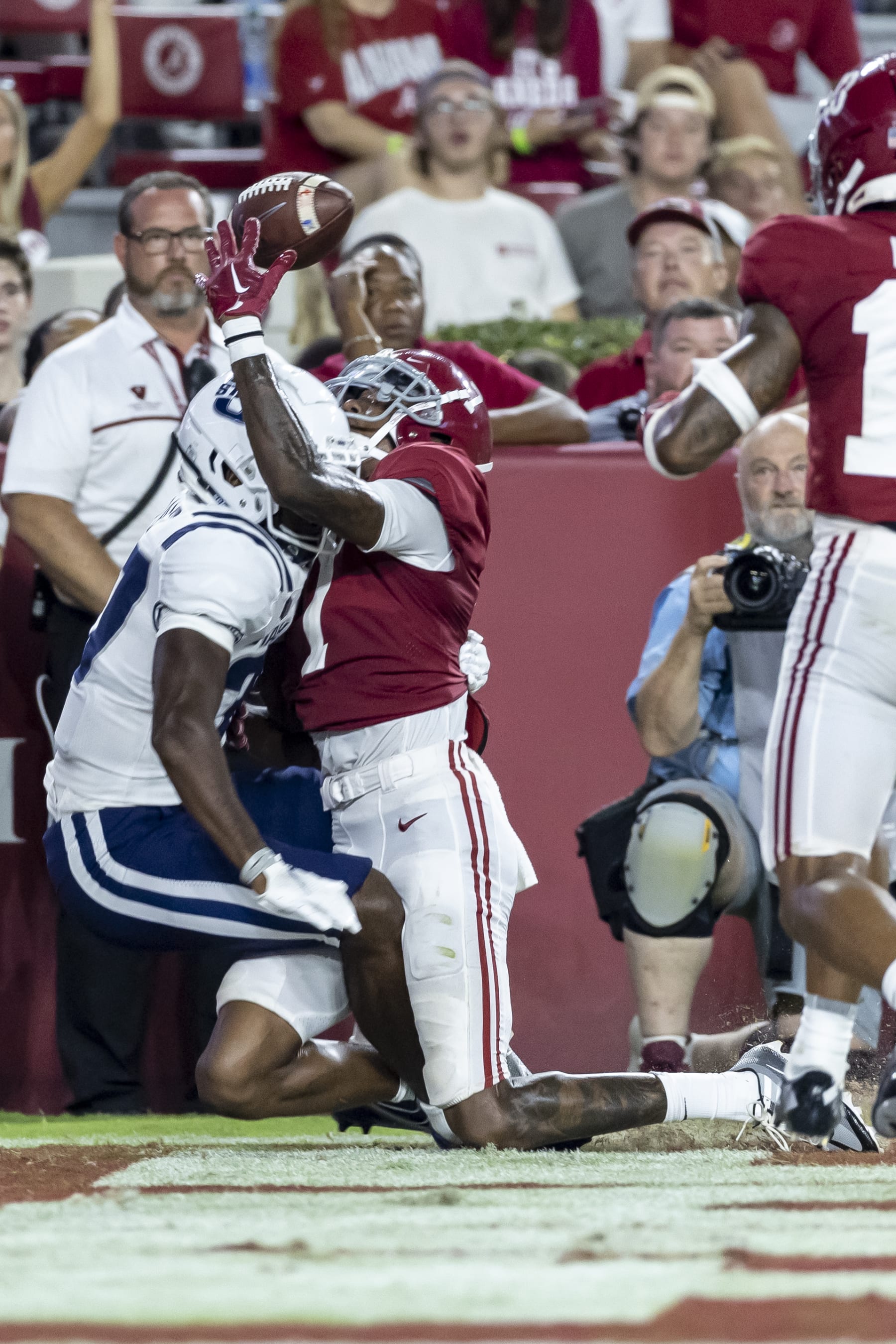 Alabama defensive back Eli Ricks (7) and Utah State wide receiver Jalen Royals (37) collide as they chase a pass in the end zone during the second half of an NCAA college football game, Saturday, Sept. 3, 2022, in Tuscaloosa, Ala. (AP Photo/Vasha Hunt)