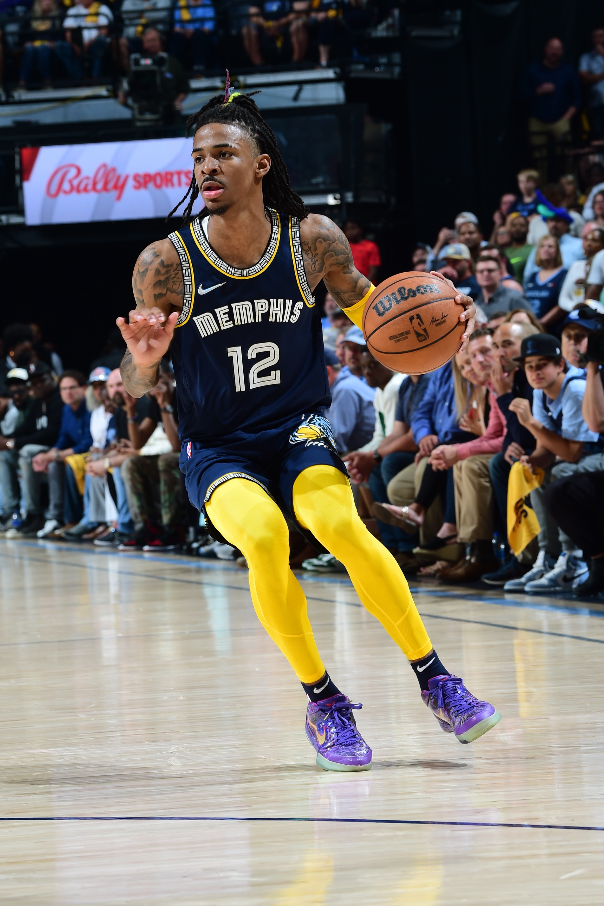 MEMPHIS, TN - MAY 3: Ja Morant #12 of the Memphis Grizzlies dribbles the ball during the game against the Golden State Warriors during Game 2 of the 2022 NBA Playoffs Western Conference Semifinals on May 3, 2022 at FedExForum in Memphis, Tennessee. NOTE TO USER: User expressly acknowledges and agrees that, by downloading and or using this photograph, user is consenting to the terms and conditions of Getty Images License Agreement. Mandatory Copyright Notice: Copyright 2022 NBAE (Photo by Noah Graham/NBAE via Getty Images)
