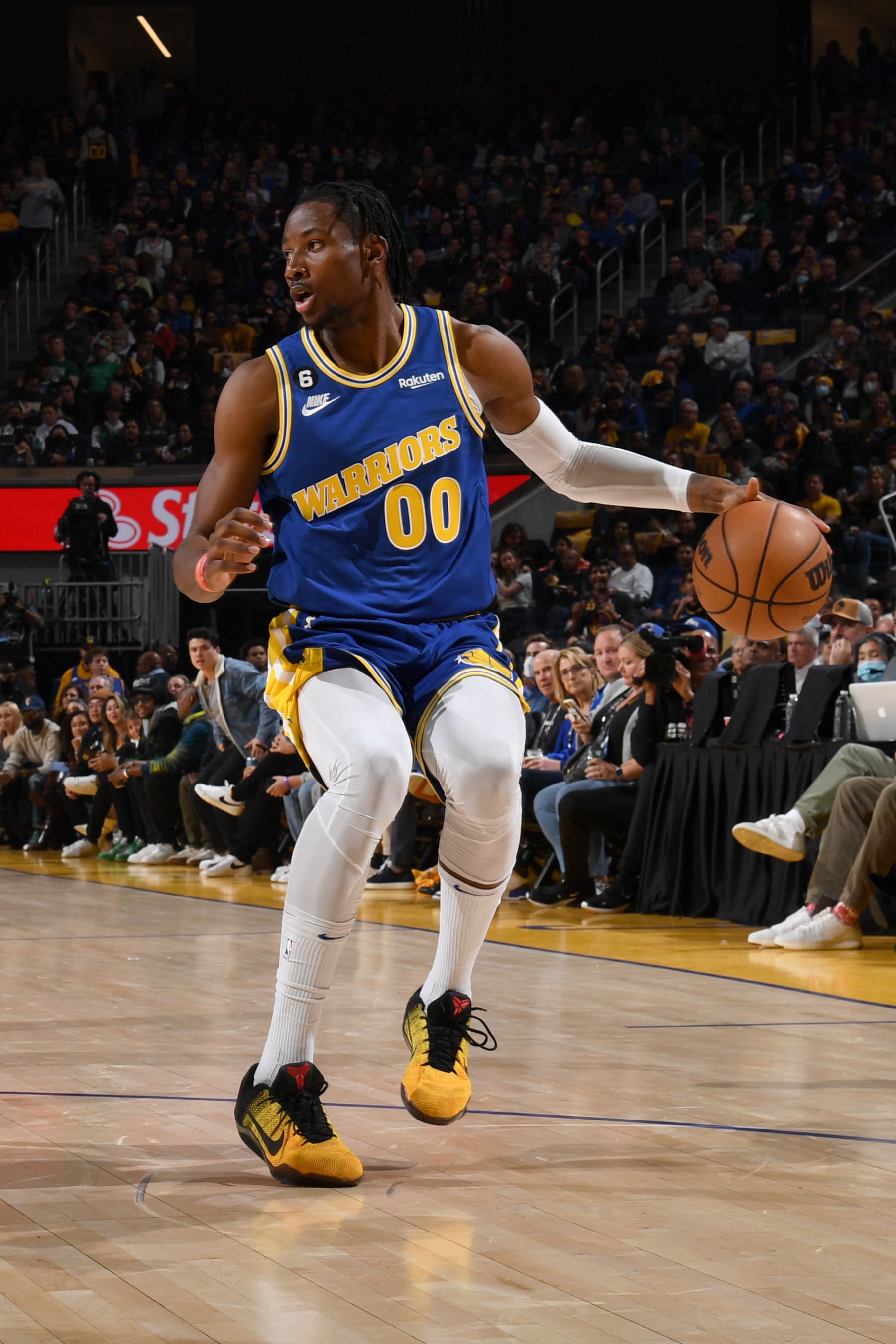 SAN FRANCISCO, CA - DECEMBER 10: Jonathan Kuminga #00 of the Golden State Warriors dribbles the ball during the game against the Boston Celtics on December 10, 2022 at Chase Center in San Francisco, California. NOTE TO USER: User expressly acknowledges and agrees that, by downloading and or using this photograph, user is consenting to the terms and conditions of Getty Images License Agreement. Mandatory Copyright Notice: Copyright 2022 NBAE (Photo by Noah Graham/NBAE via Getty Images)