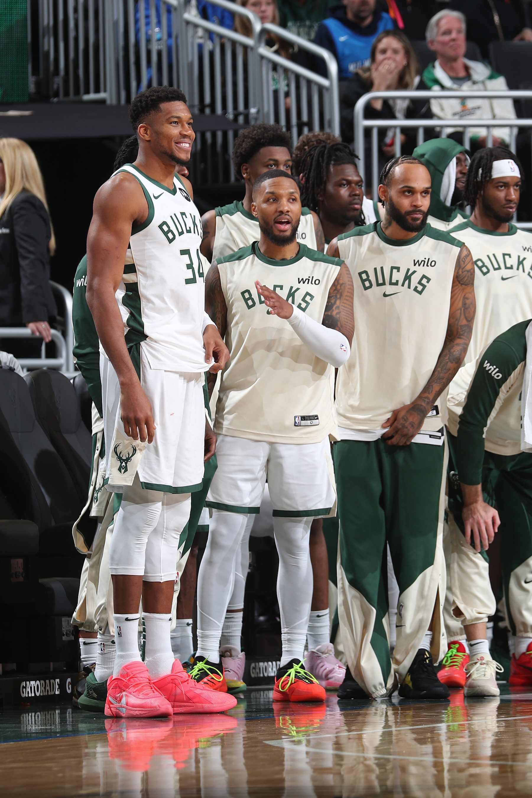 MILWAUKEE, WI - OCTOBER 14: Damian Lillard #0 and Giannis Antetokounmpo #34 of the Milwaukee Bucks smile during the game against the Chicago Bulls on October 14, 2024 at Fiserv Forum Center in Milwaukee, Wisconsin. NOTE TO USER: User expressly acknowledges and agrees that, by downloading and or using this Photograph, user is consenting to the terms and conditions of the Getty Images License Agreement. Mandatory Copyright Notice: Copyright 2024 NBAE (Photo by Gary Dineen/NBAE via Getty Images).