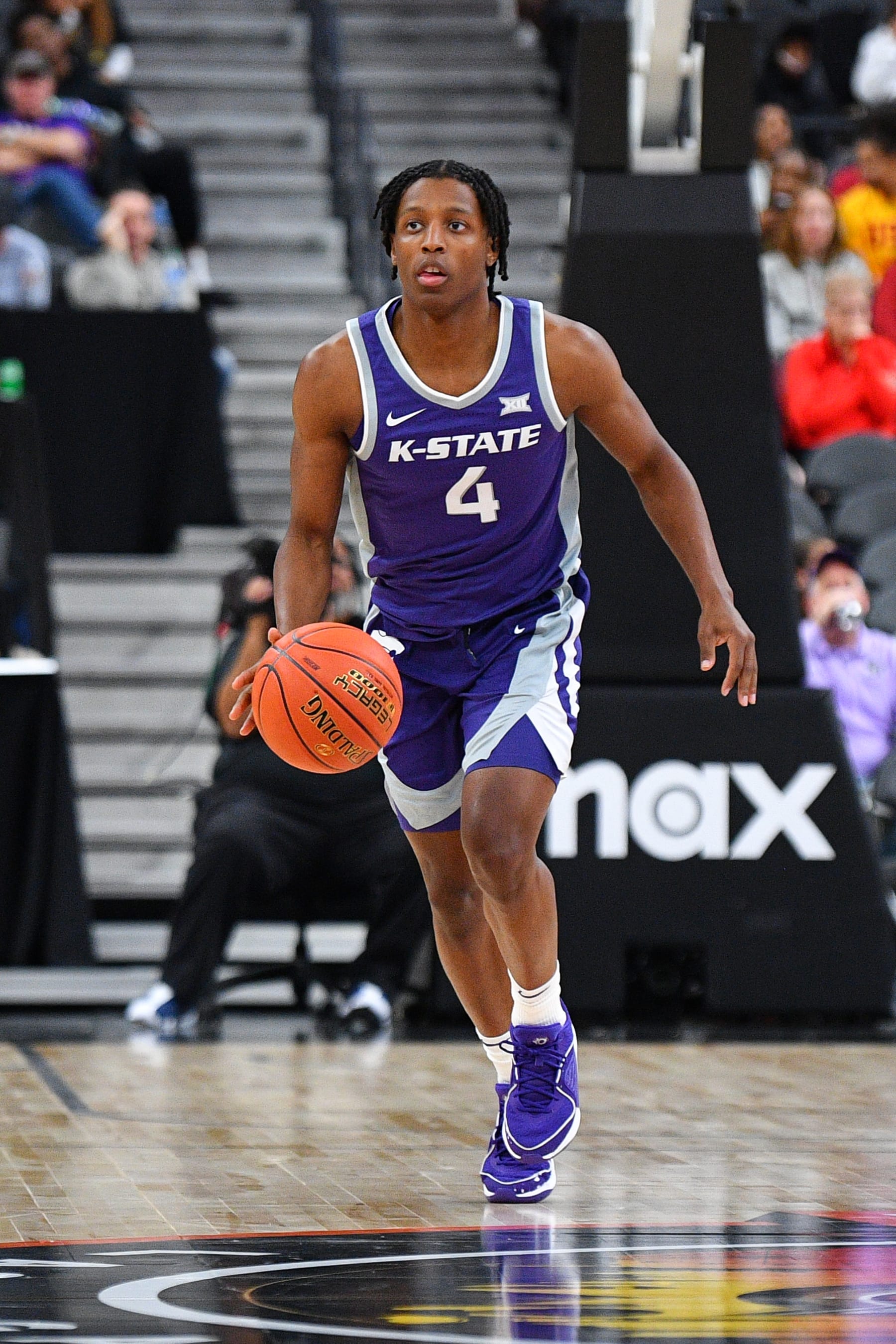 LAS VEGAS, NV - NOVEMBER 06: Kansas State Wildcats guard Dai Dai Ames (4) dribbles up the court during the Hall of Fame Series, a college basketball game between the Kansas State Wildcats and the USC Trojans on November 6, 2023 at T-Mobile Arena in Las Vegas, NV. (Photo by Brian Rothmuller/Icon Sportswire via Getty Images)