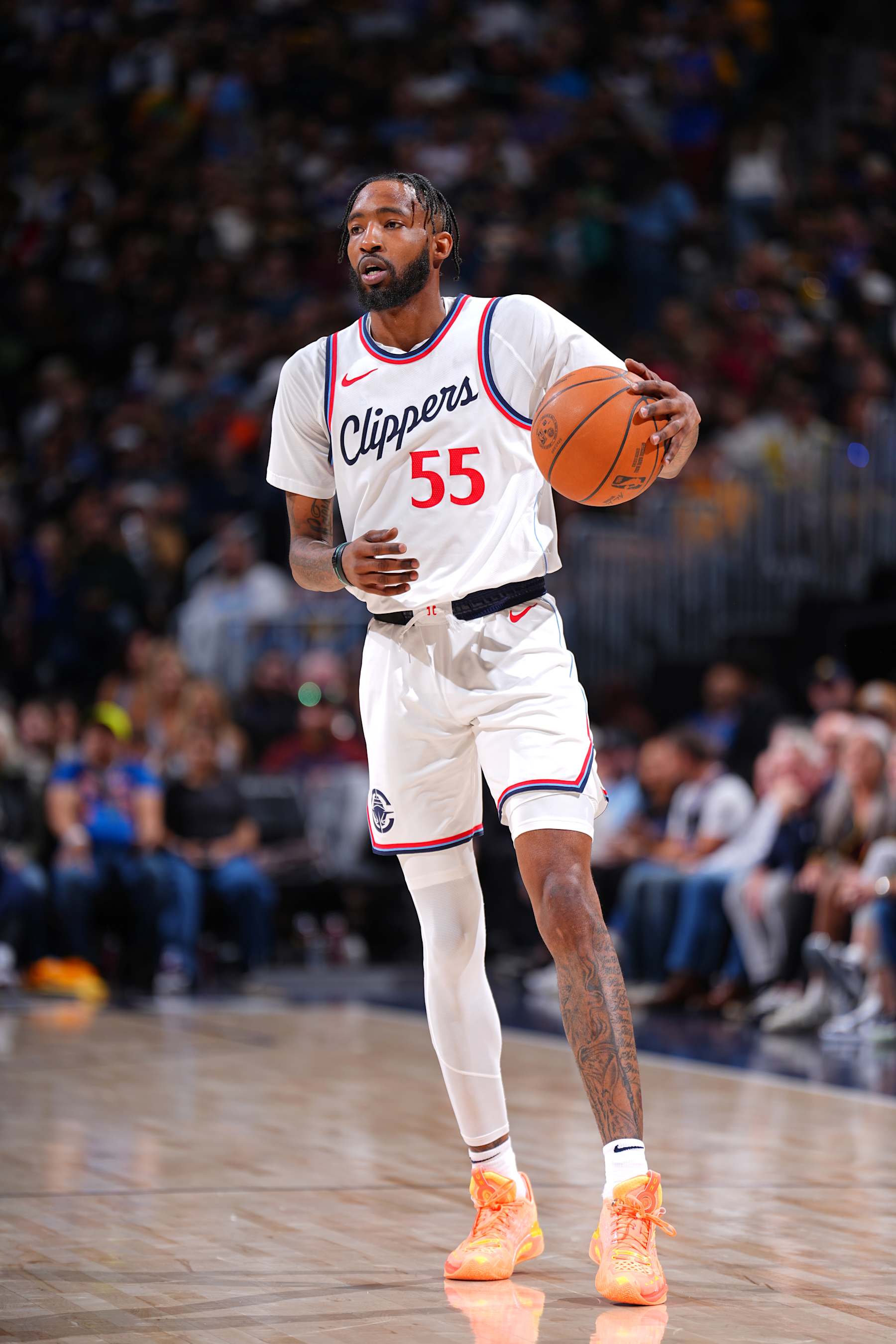 DENVER, CO - OCTOBER 26: Derrick Jones Jr. #55 of the LA Clippers looks on during the game against the Denver Nuggets on October 26, 2024 at the Ball Arena in Denver, Colorado. NOTE TO USER: User expressly acknowledges and agrees that, by downloading and/or using this Photograph, user is consenting to the terms and conditions of the Getty Images License Agreement. Mandatory Copyright Notice: Copyright 2024 NBAE (Photo by Garrett Ellwood/NBAE via Getty Images)