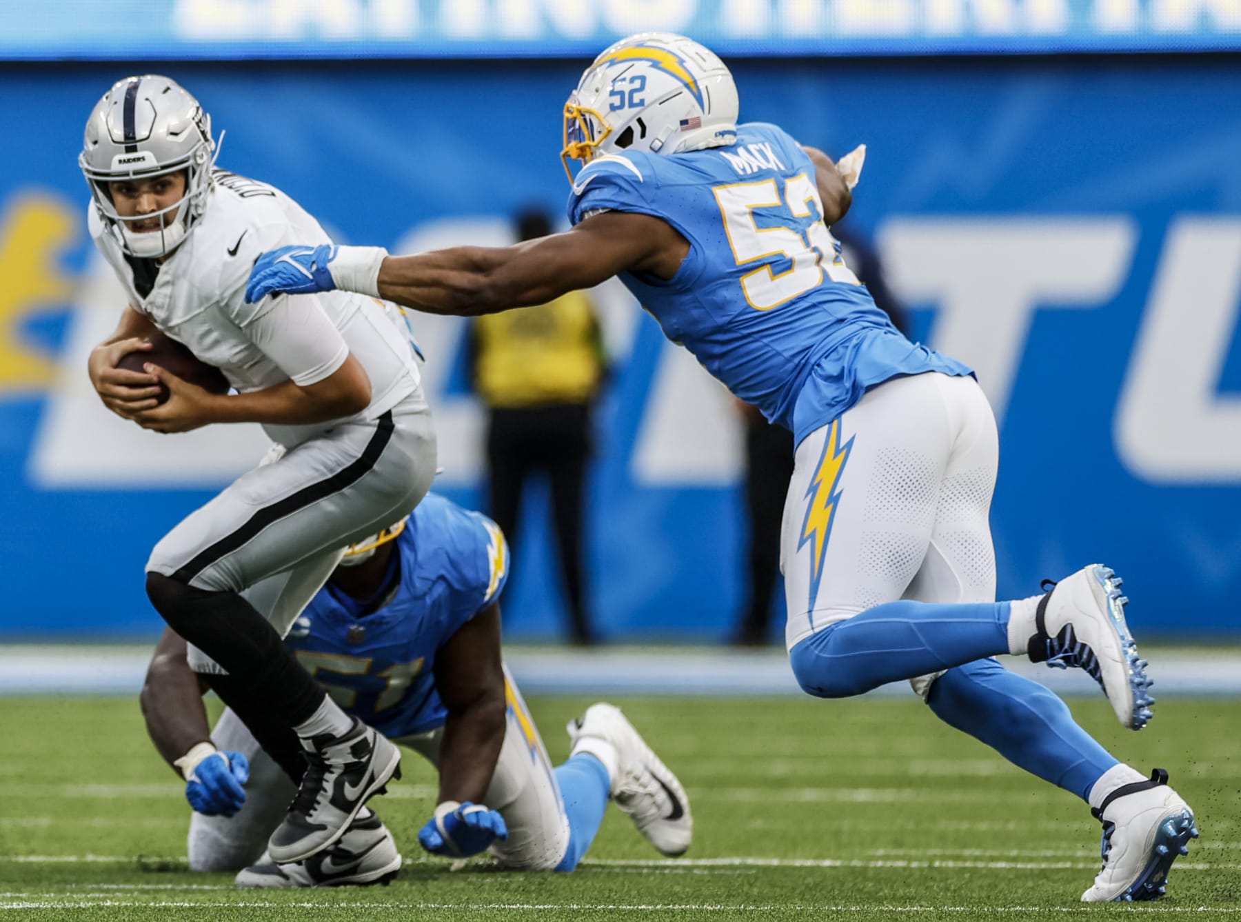 Inglewood, CA, Sunday, October 1, 2023 - Los Angeles Chargers linebacker Khalil Mack (52) closes in for a second half sack of Las Vegas Raiders quarterback Aidan O'Connell (4) at SoFi Stadium. (Robert Gauthier/Los Angeles Times via Getty Images)