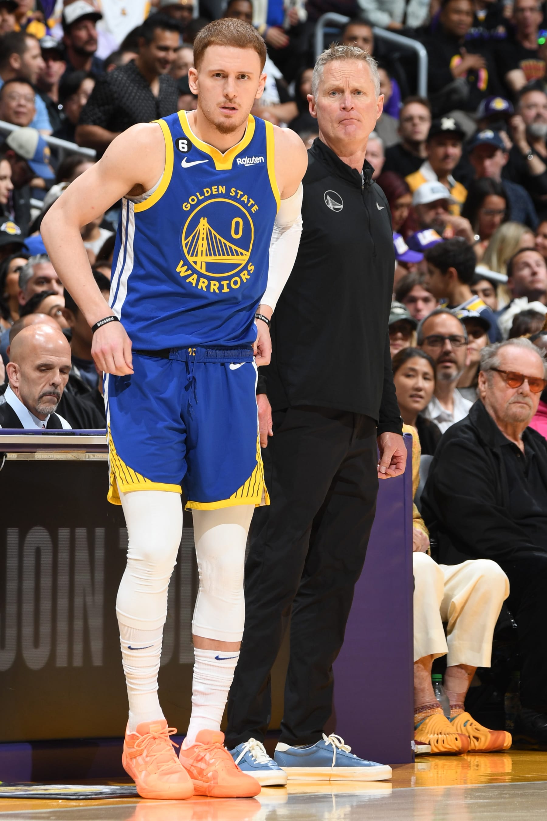 LOS ANGELES, CA - MAY 12: Donte DiVincenzo #0 of the Golden State Warriors and Head Coach Steve Kerr of the Golden State Warriors look on during Game 6 of the Western Conference Semi-Finals 2023 NBA Playoffs on May 12, 2023 at Crypto.Com Arena in Los Angeles, California. NOTE TO USER: User expressly acknowledges and agrees that, by downloading and/or using this Photograph, user is consenting to the terms and conditions of the Getty Images License Agreement. Mandatory Copyright Notice: Copyright 2023 NBAE (Photo by Andrew D. Bernstein/NBAE via Getty Images)