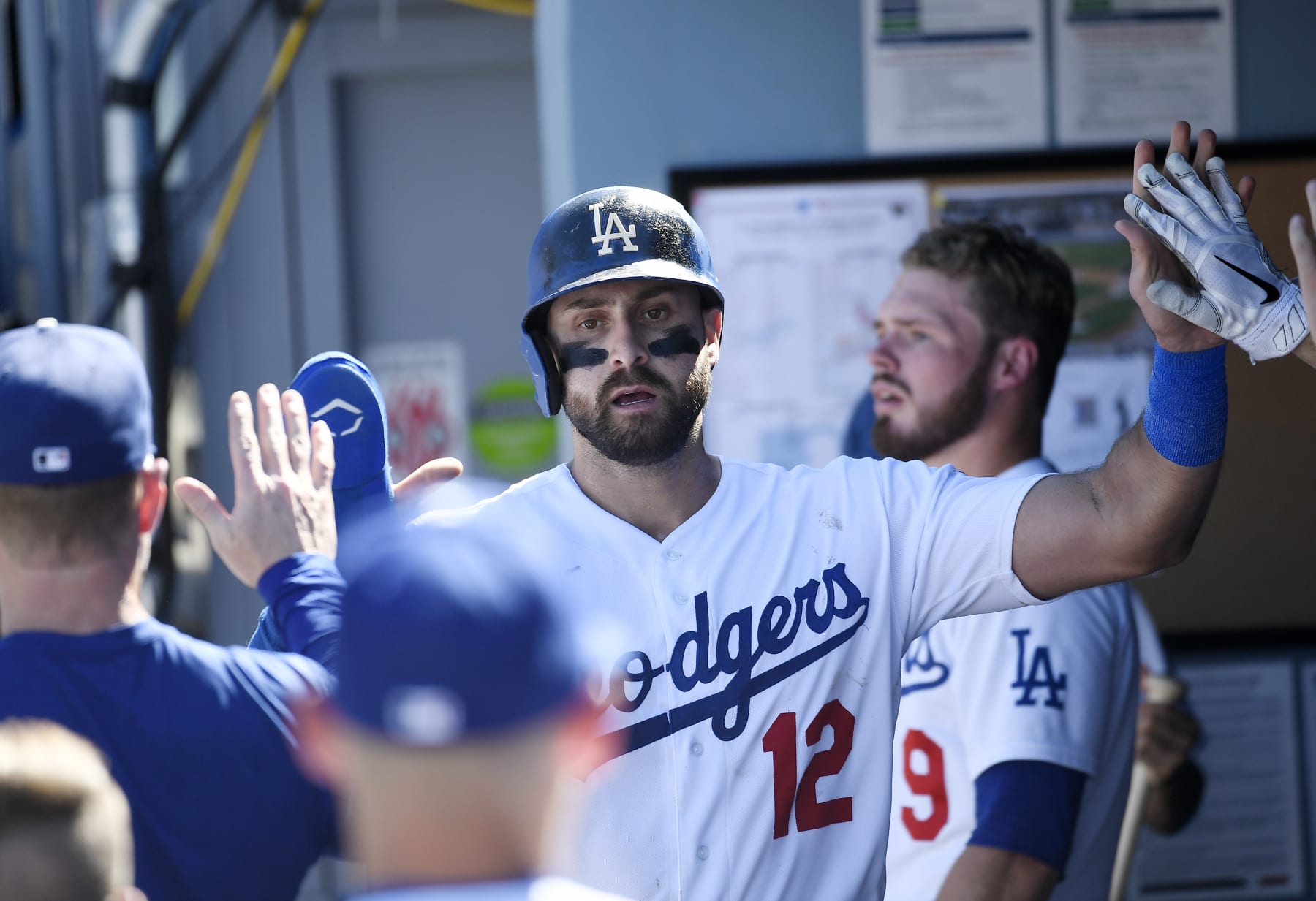 LOS ANGELES, CA - SEPTEMBER 25: Joey Gallo #12 of the Los Angeles Dodgers is congratulated after scoring a run against the St. Louis Cardinals during the third inning at Dodger Stadium on September 25, 2022 in Los Angeles, California. (Photo by Kevork Djansezian/Getty Images)